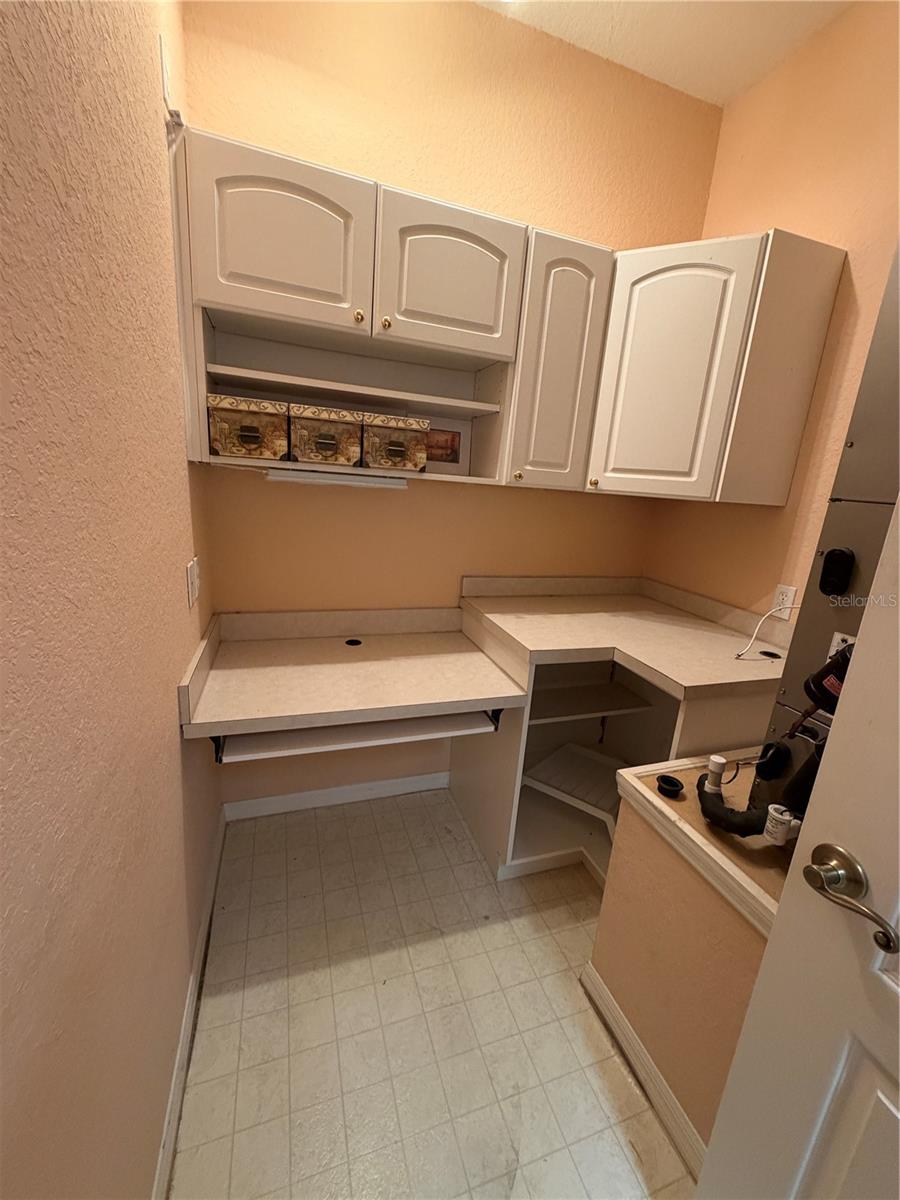 small office/work area in back of laundry room