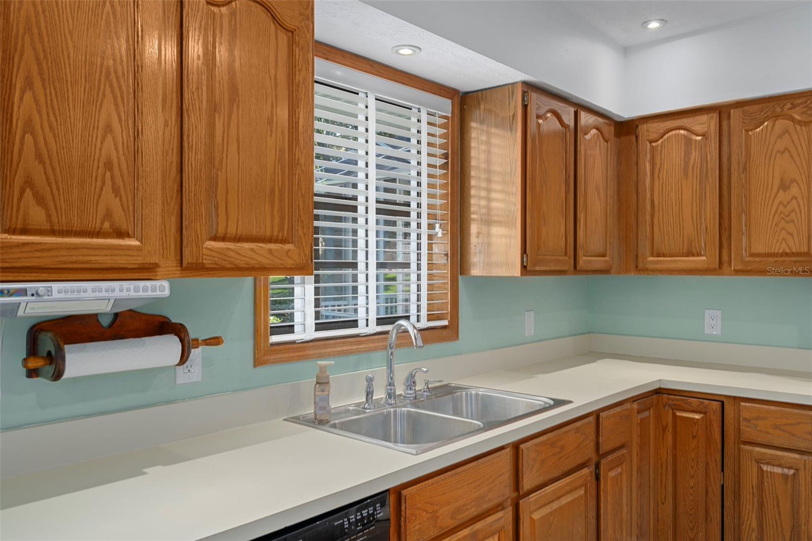 Kitchen with Window Overlooking Backyard