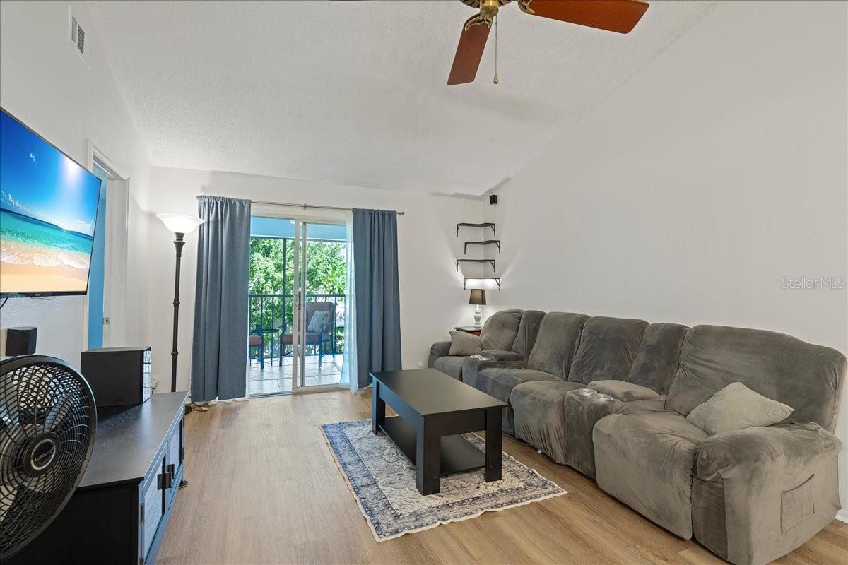 Living room with glass sliders out to balcony