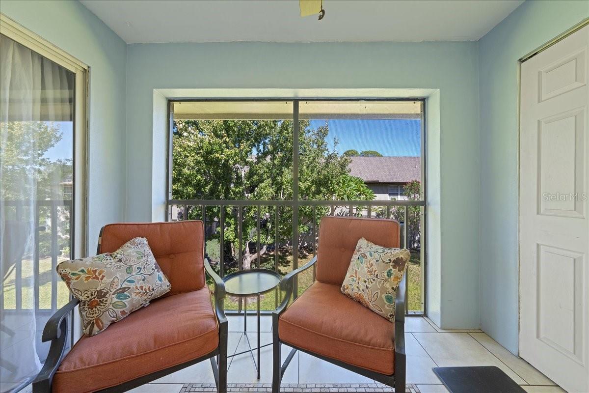 Balcony with access from living room and primary bedroom. Includes laundry closet