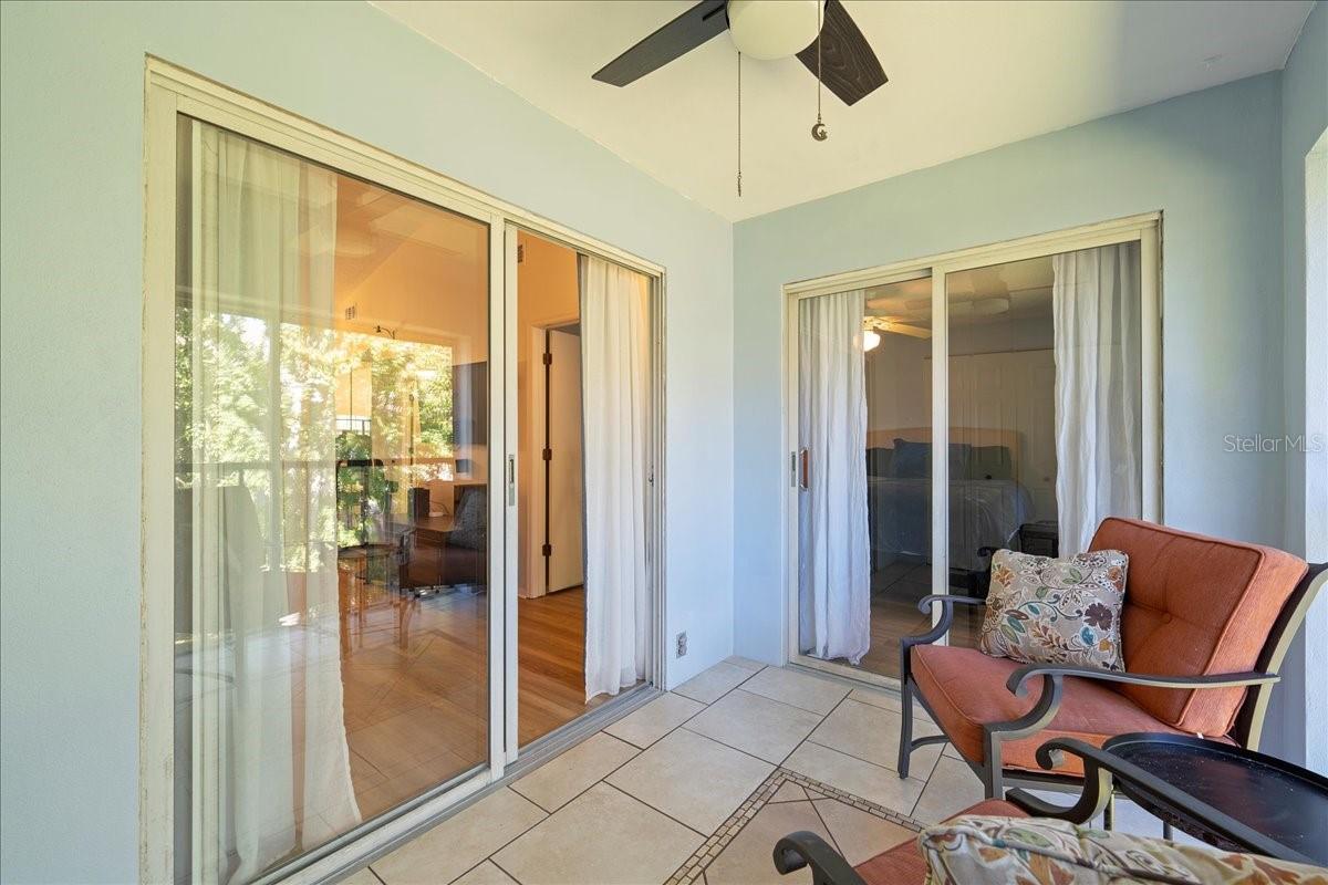 Balcony with access from living room and primary bedroom. Includes laundry closet