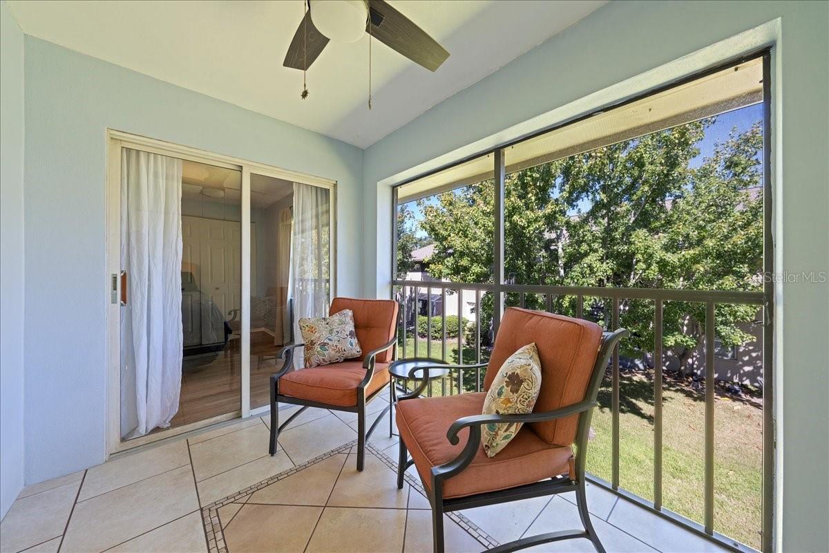 Balcony with access from living room and primary bedroom. Includes laundry closet