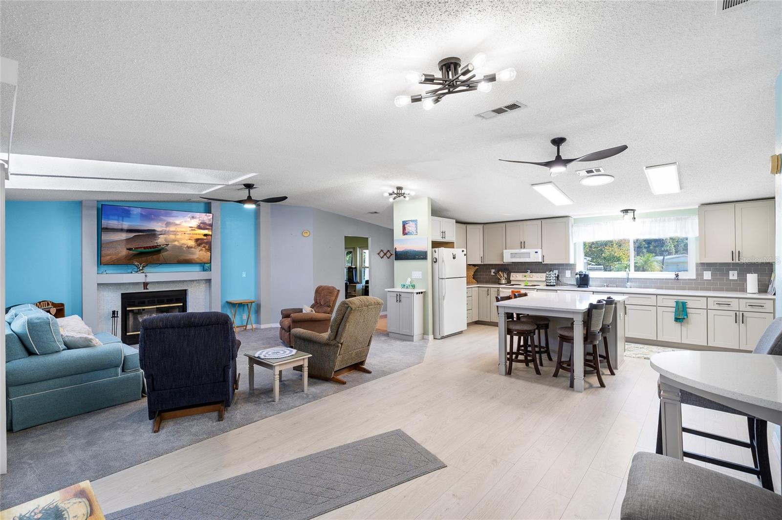 Open airy Florida-style living space with new ceiling fans,