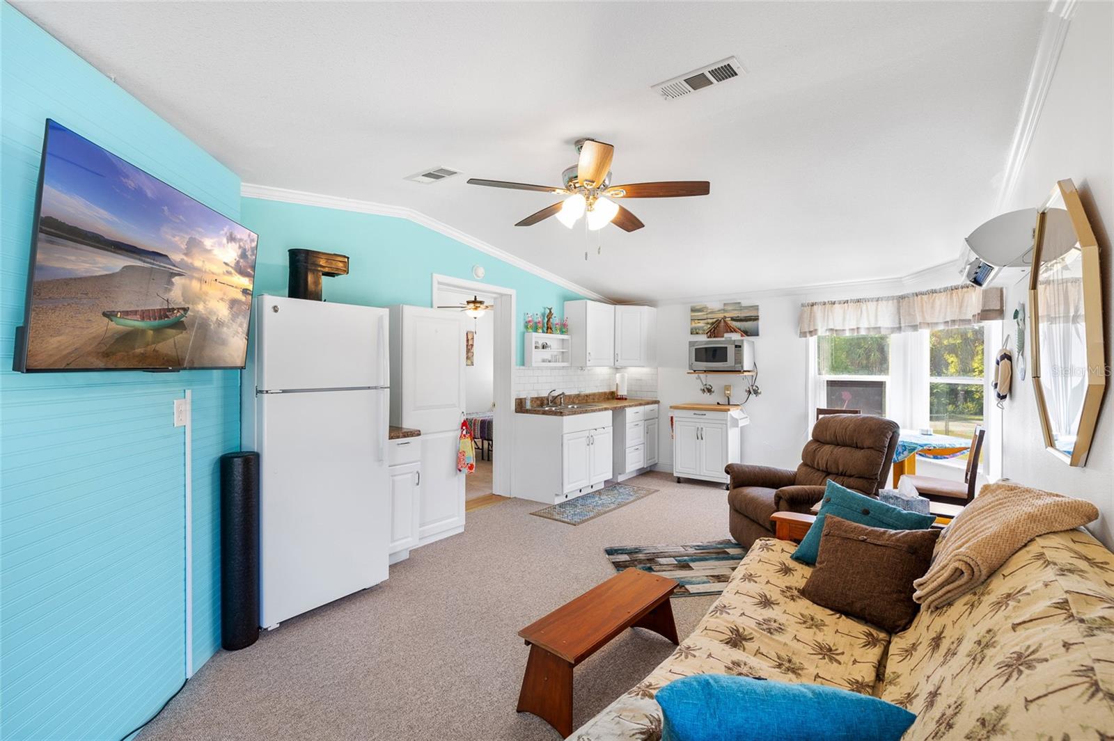 In-Law suite/guest room with kitchenette, ceiling fan and more