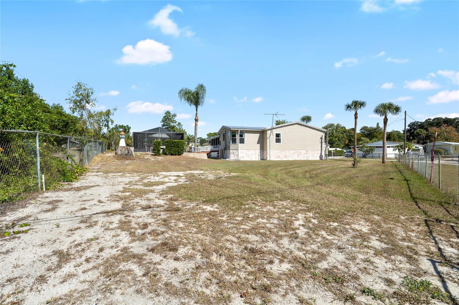 Look at all the property this double lot with private salt water pool, & fenced in remote controlled auto gate offers.