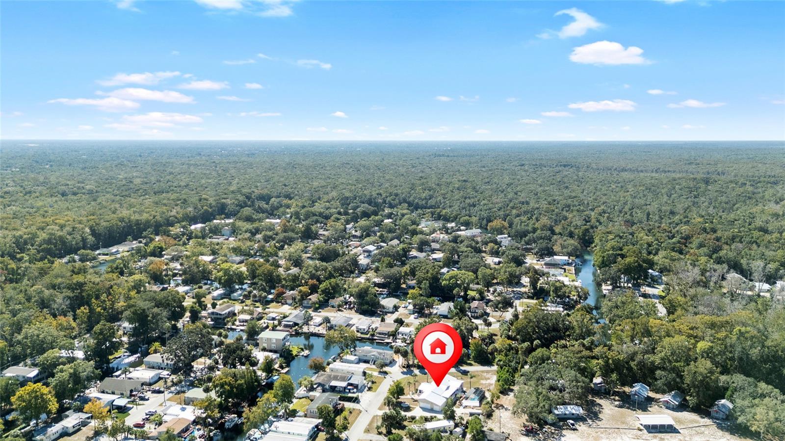 Look at the red icon to locate this spacious double lot with pool directly across the street from the water
