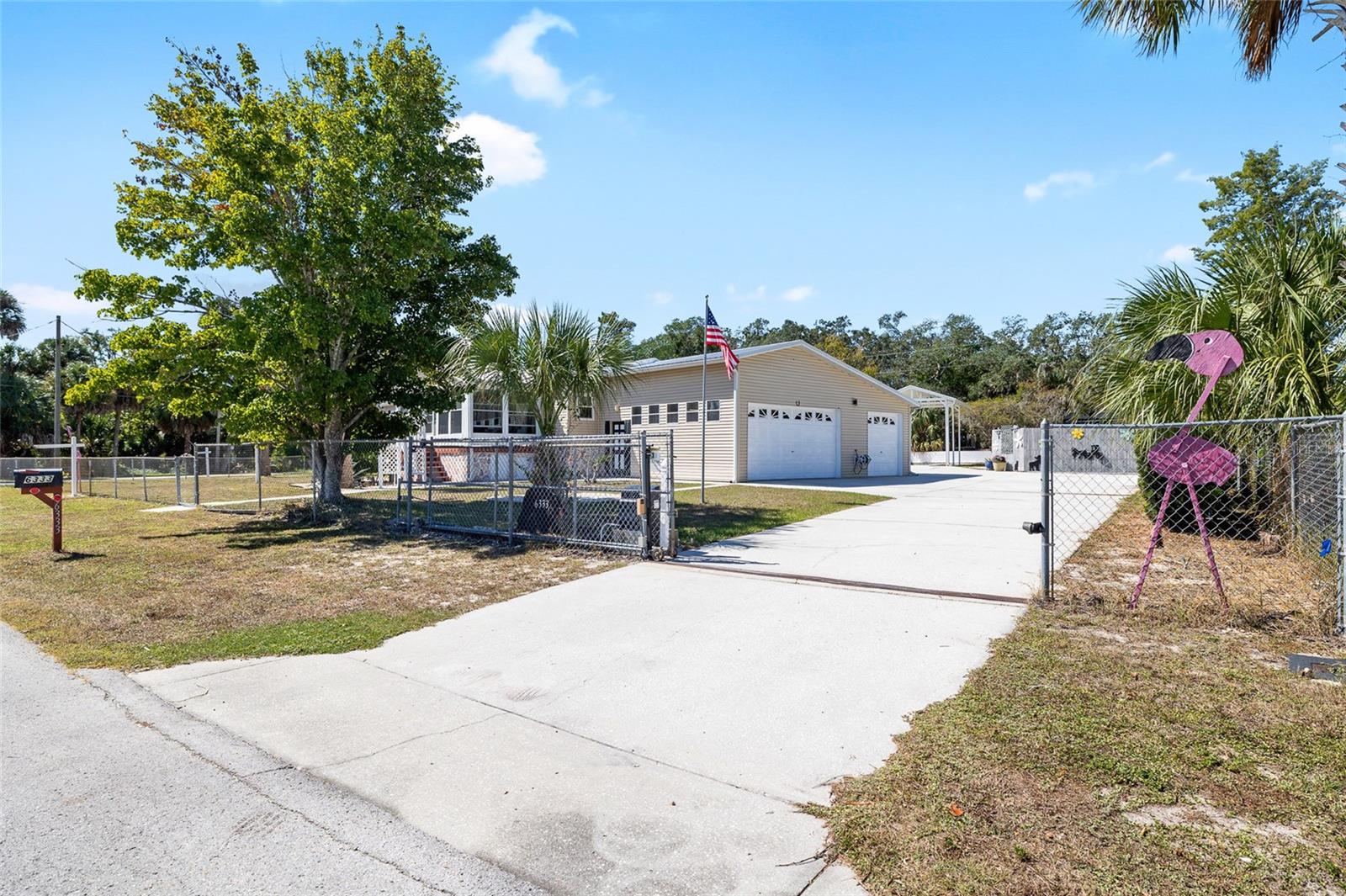 Look at this fabulous private double lot spacious, updated salt water pool home, with a gated property entrance with remote controlled automatic gate entry and tons of parking and a 3 car garage and covered RV parking spot with dump station, plenty of parking with garden, storage galore, firepit area, screen rooms, and more!