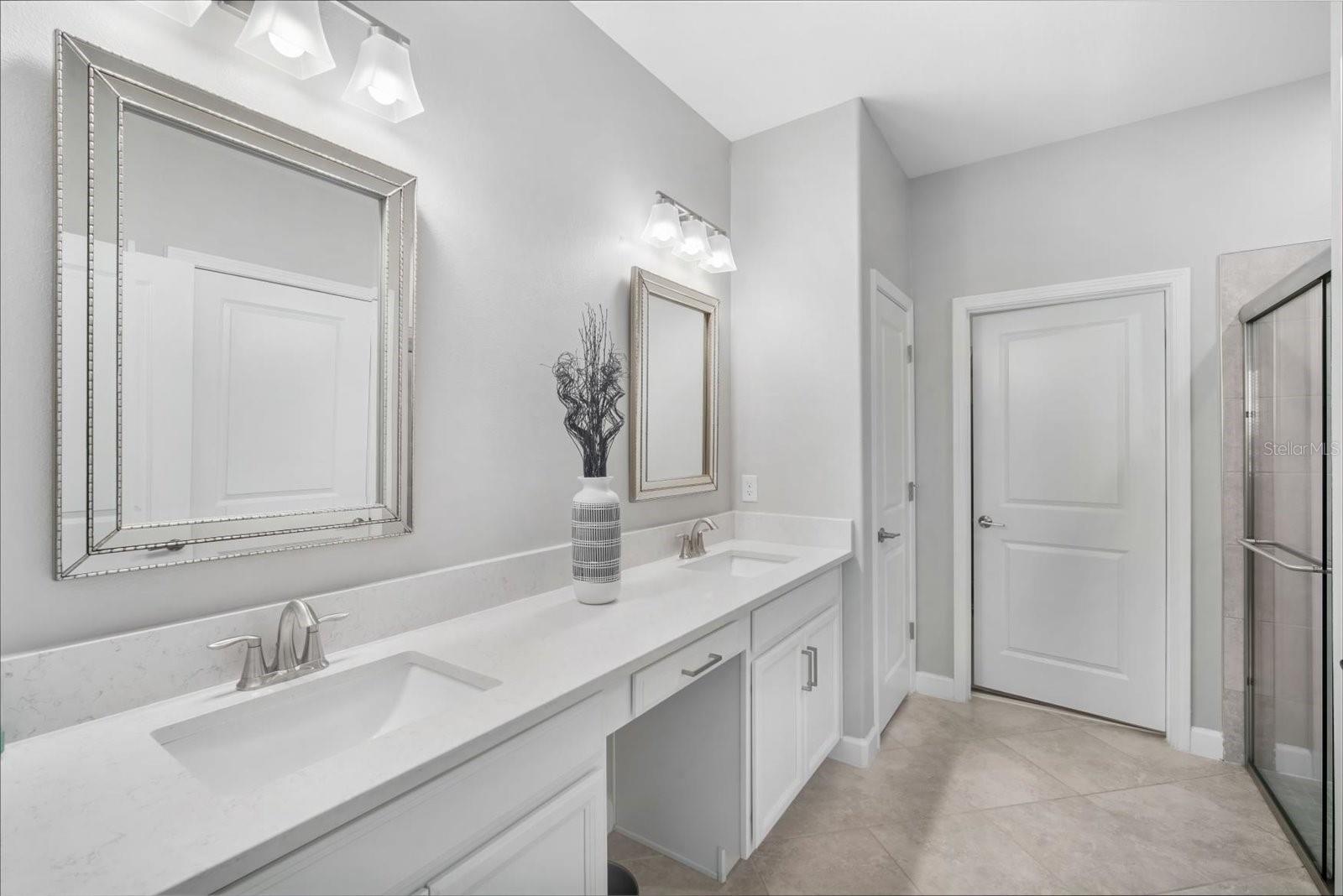 Primary bath has dual sinks, another linen closet and full walk in closet
