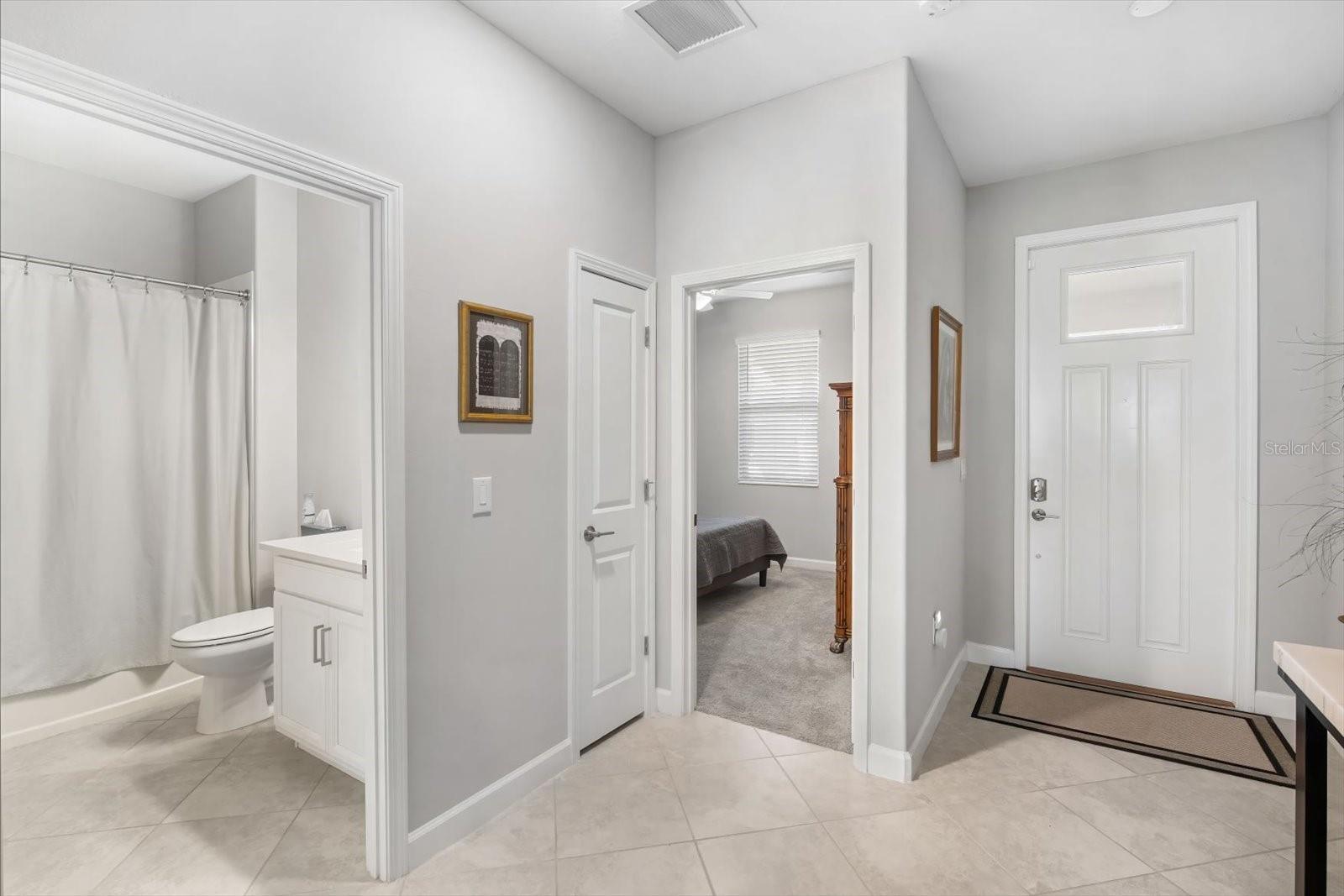 Entry way is spacious and has room for personal touch. Extra storage closet is so handy.