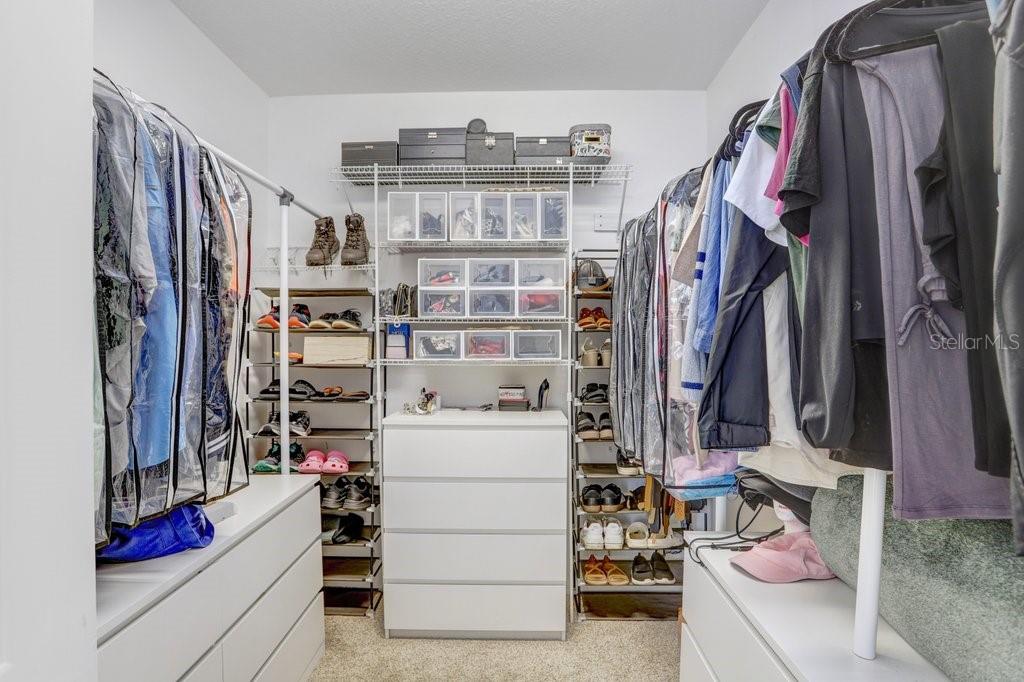 Primary Walk-in Closet with Custom Built Ins