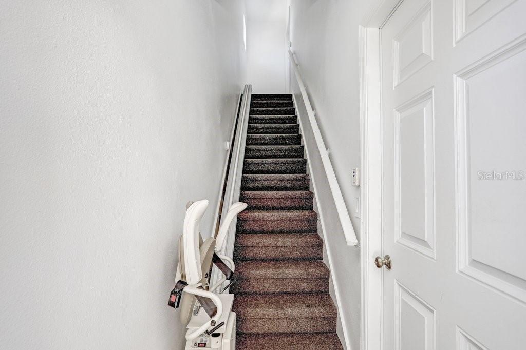 Stairway Chair Lift to Mother in Law Suite Above Garage
