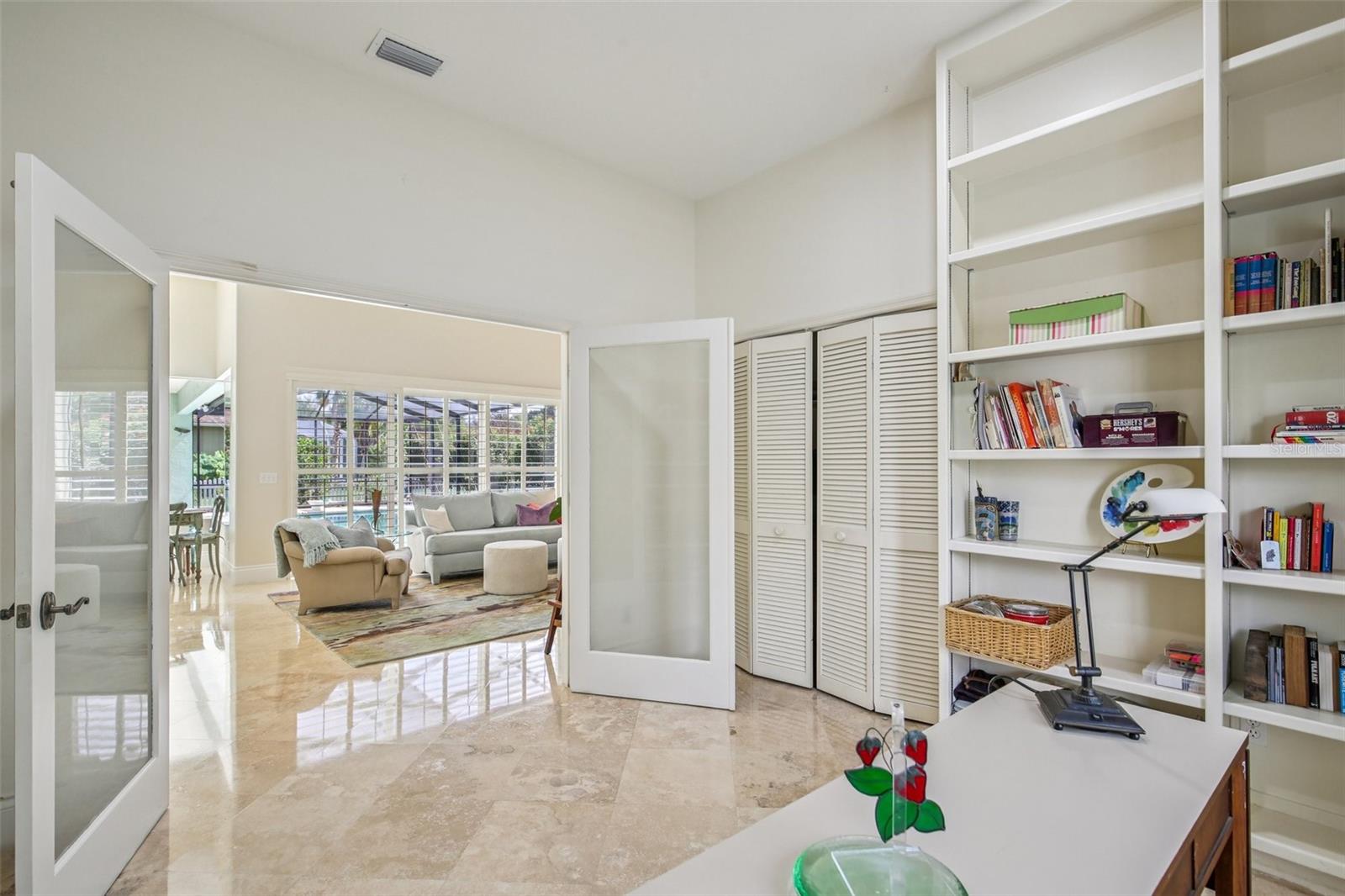 DOUBLE DOORS LEAD TO BEDROOM 4 WHICH HAS BUILT-INS AND CURRENTLY USED AS A CRAFT ROOM