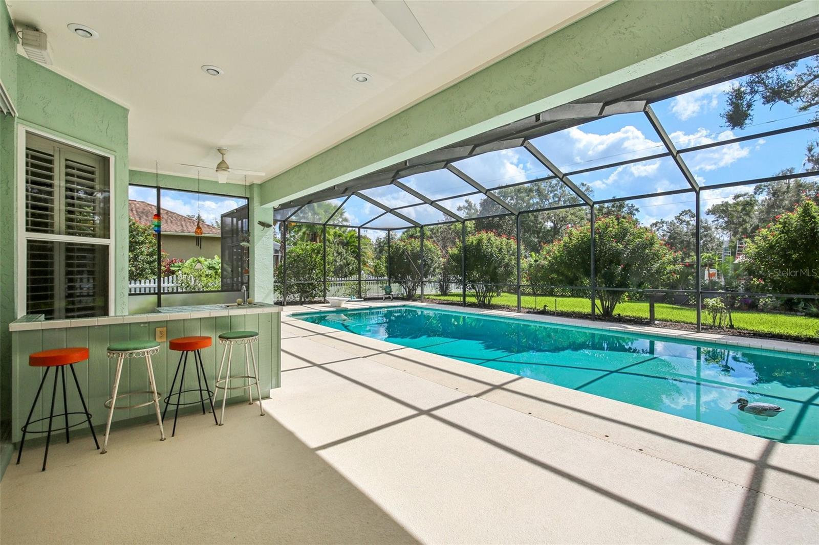 ENJOY FLORIDA LIVING! SCREENED POOL WITH COVERED LANAI PROVIDES A GREAT WEEKEND RETREAT!