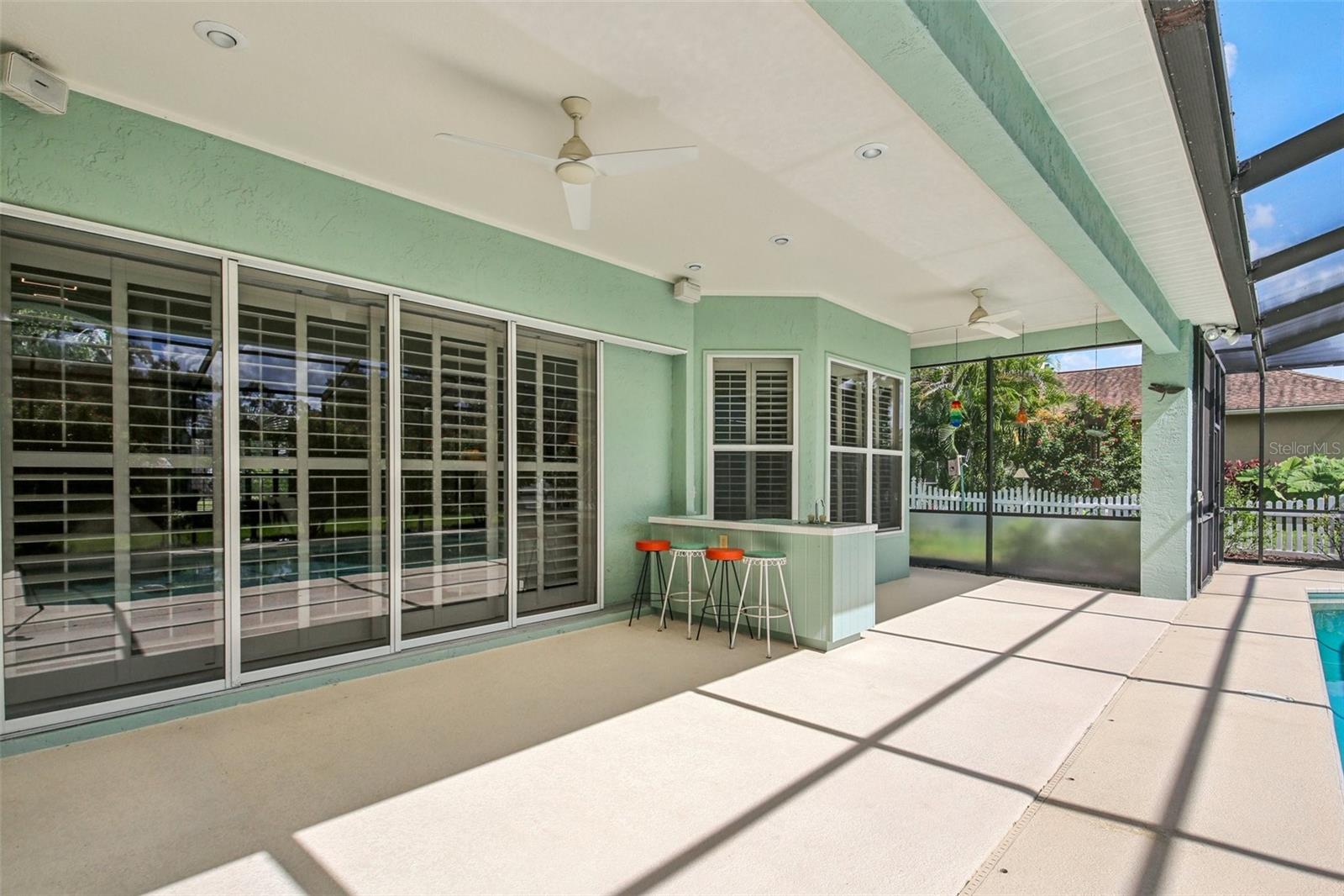 ENJOY FLORIDA LIVING! SCREENED POOL WITH COVERED LANAI PROVIDES A GREAT WEEKEND RETREAT!