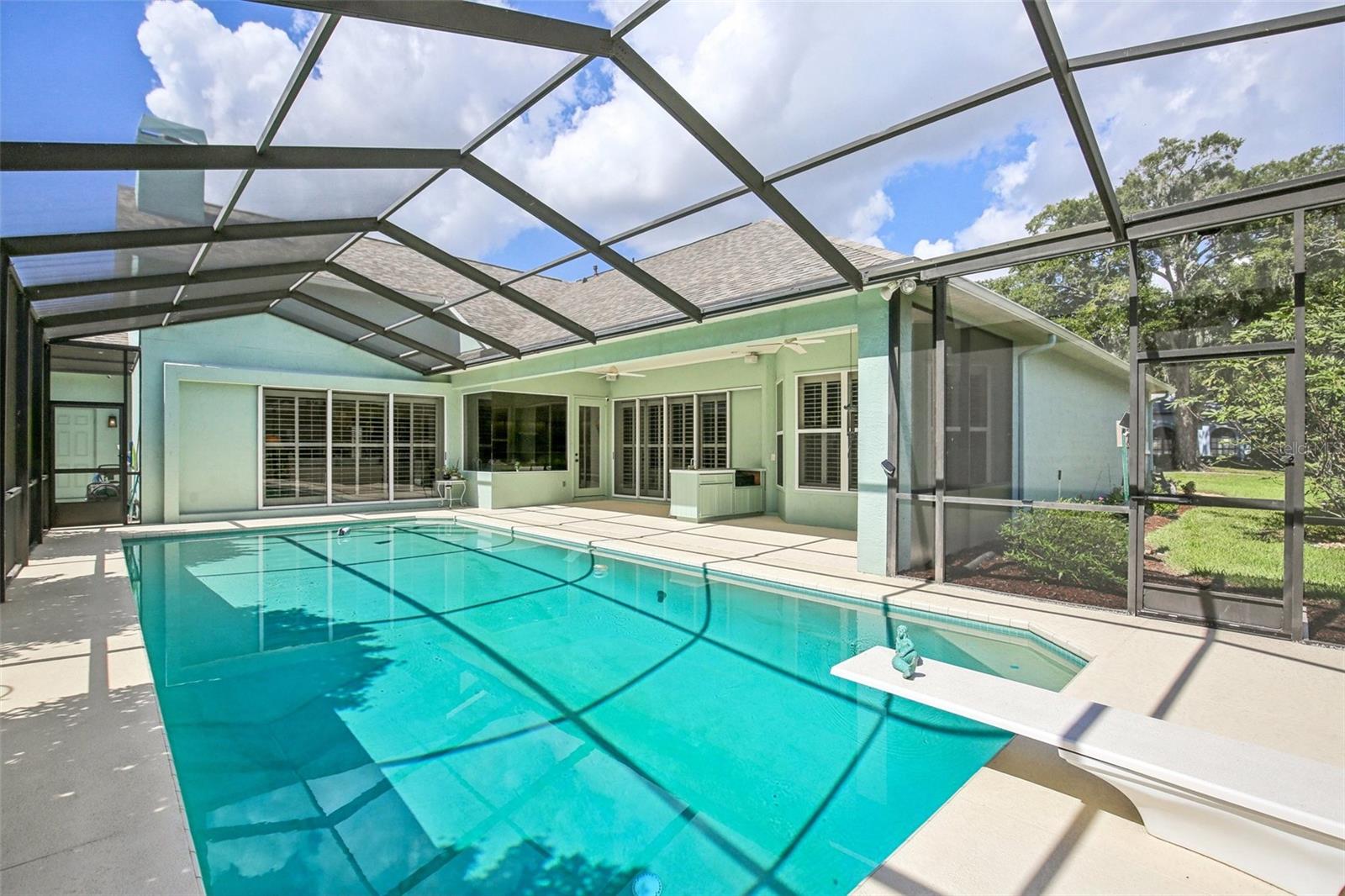 ENJOY FLORIDA LIVING! SCREENED POOL WITH COVERED LANAI PROVIDES A GREAT WEEKEND RETREAT!
