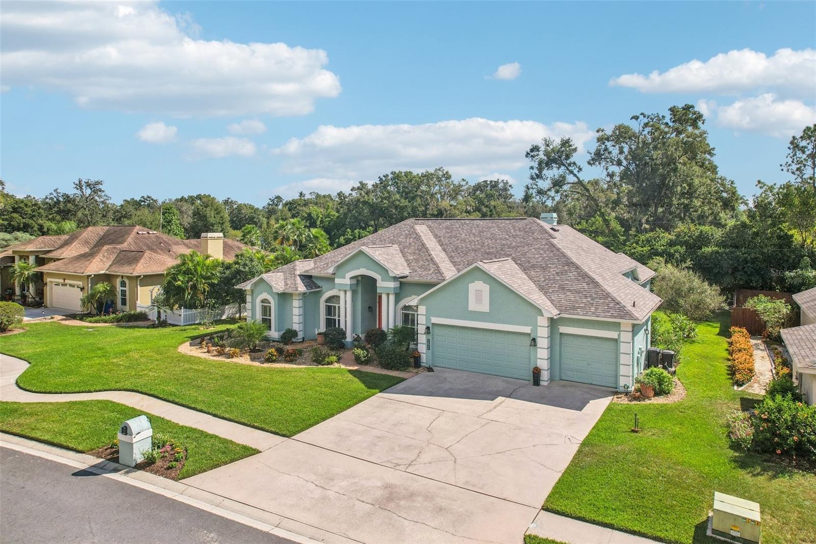 3 CAR GARAGE WITH LARGE DRIVEWAY PROVIDES PLENT OF PARKING FOR FAMILY AND GUESTS