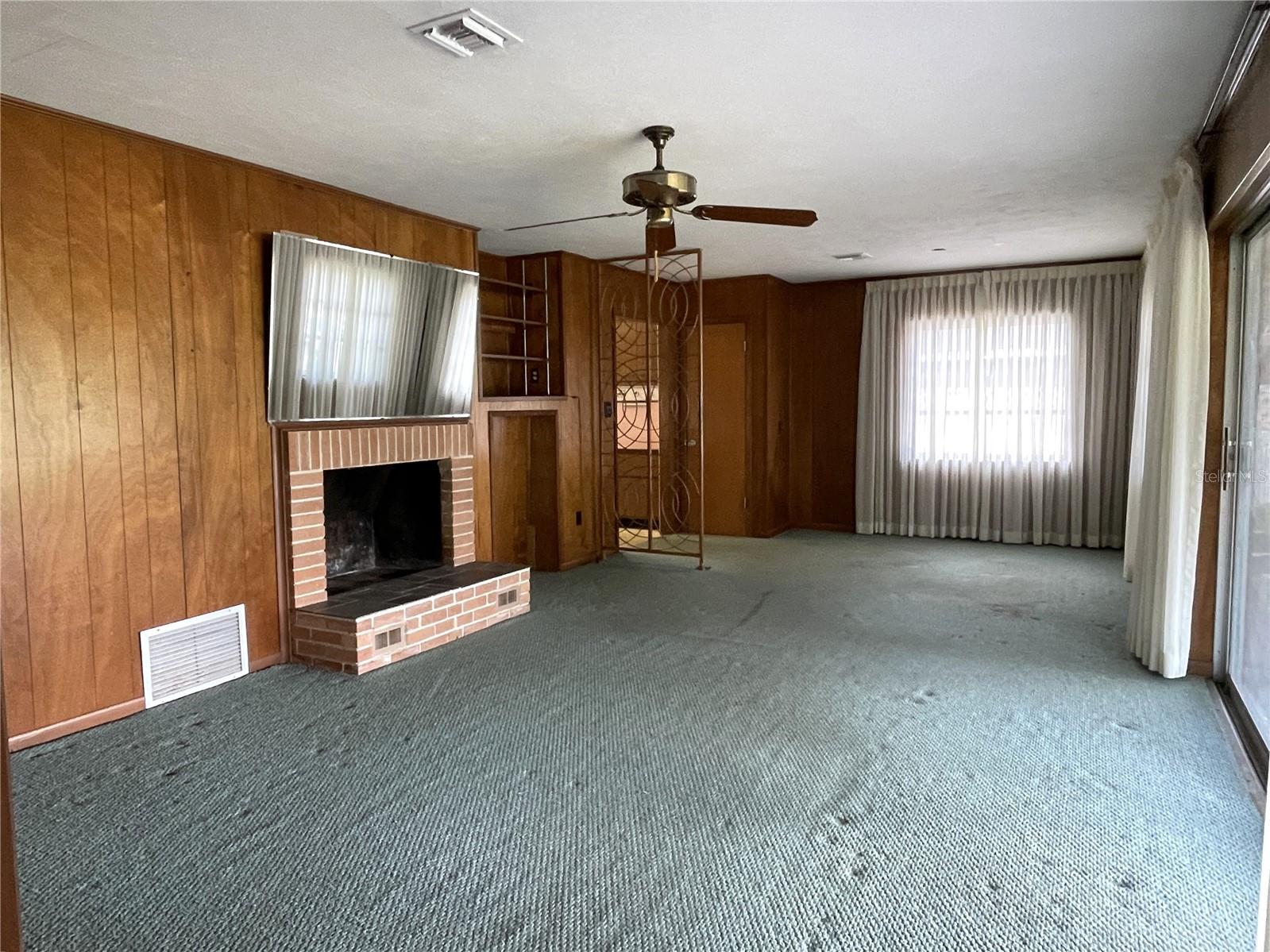 Family Room with fireplace and sliders