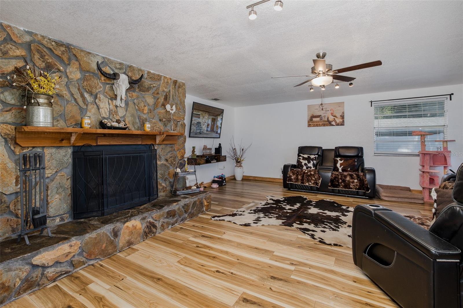 Large wood-burning stone fireplace