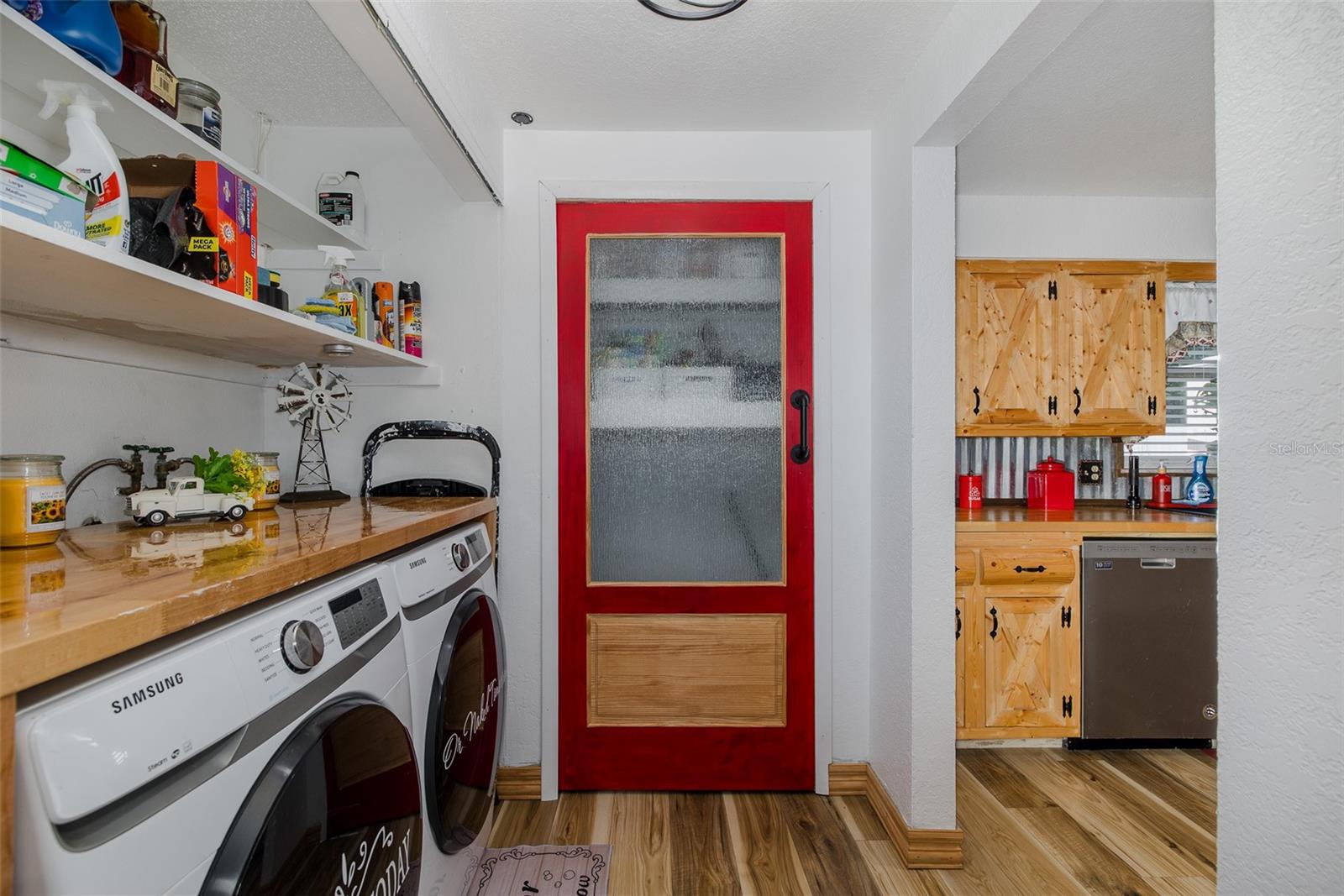 Laundry area and pantry adjacent to kitchen