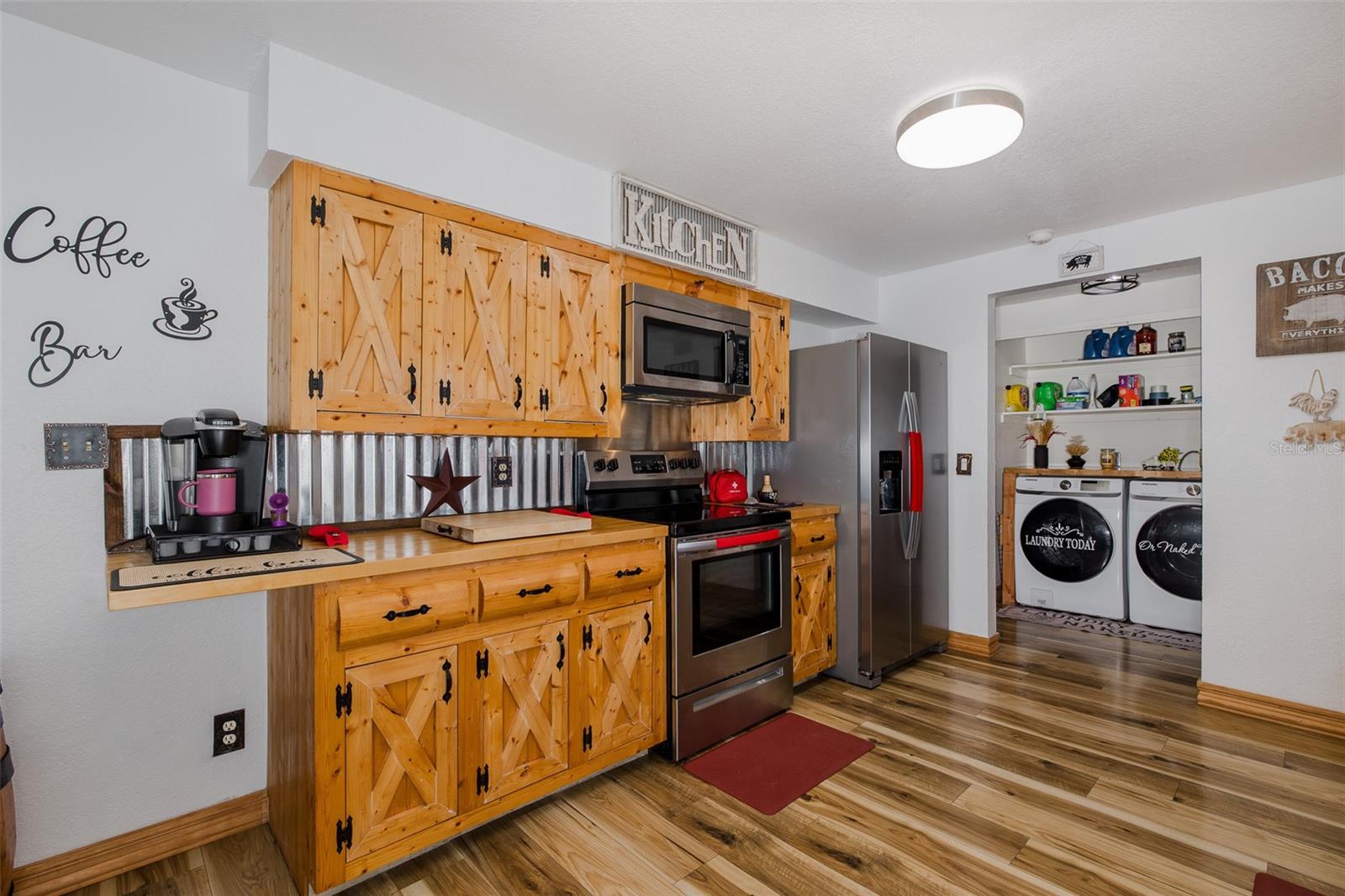 Large kitchen with custom-made cabinets and butcher block counters