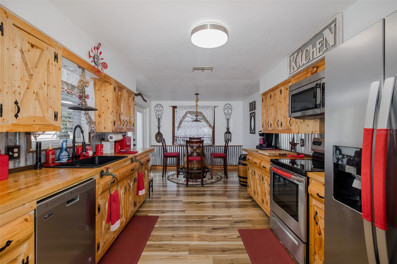 Large eat-in kitchen with custom-made cabinets and butcher block counters