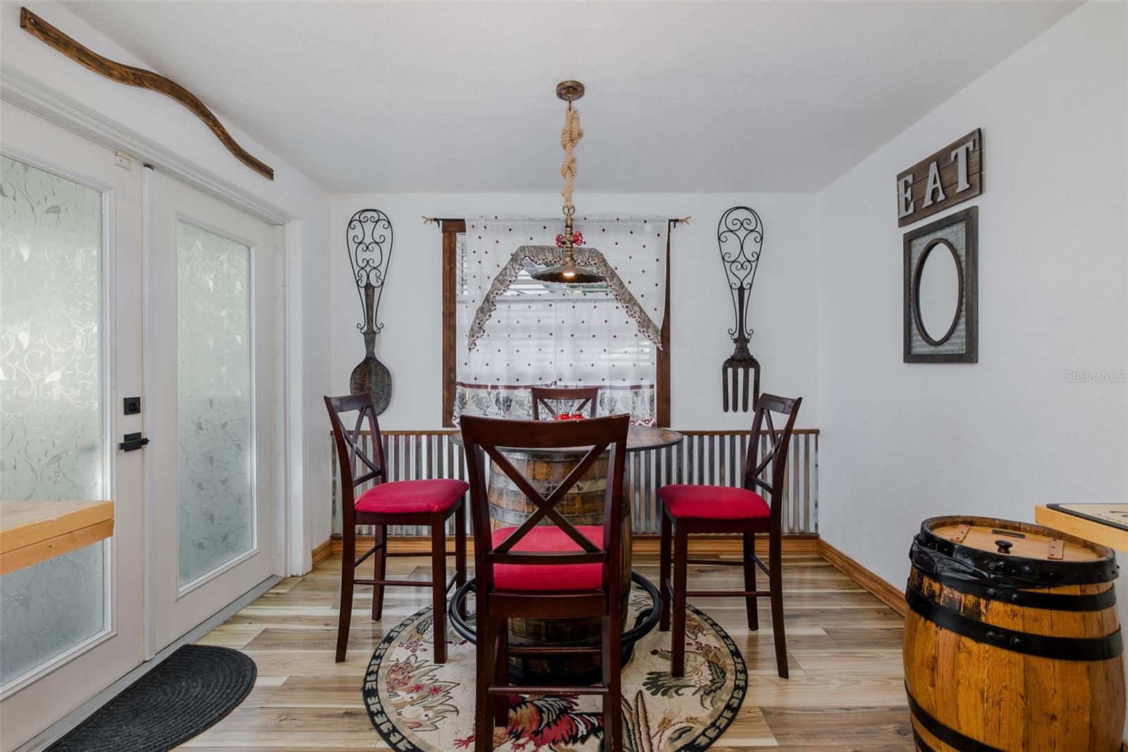 Eat-in kitchen with French doors to back patio and yard