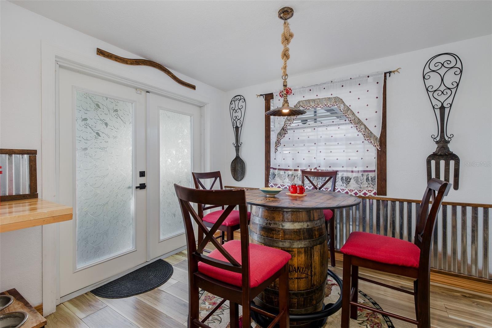 Eat-in kitchen with French doors to back patio and yard