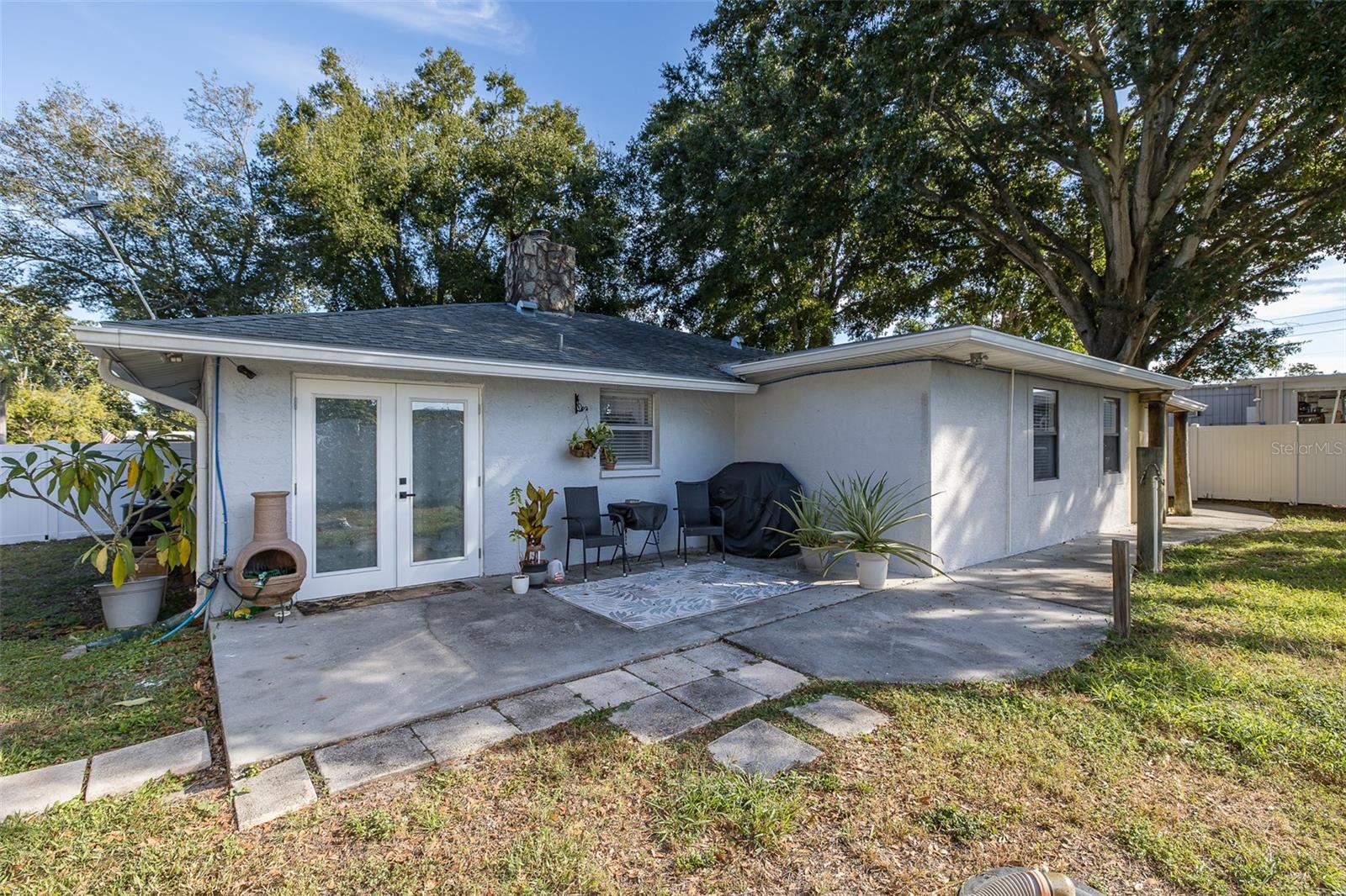 Back of house. French doors to kitchen.