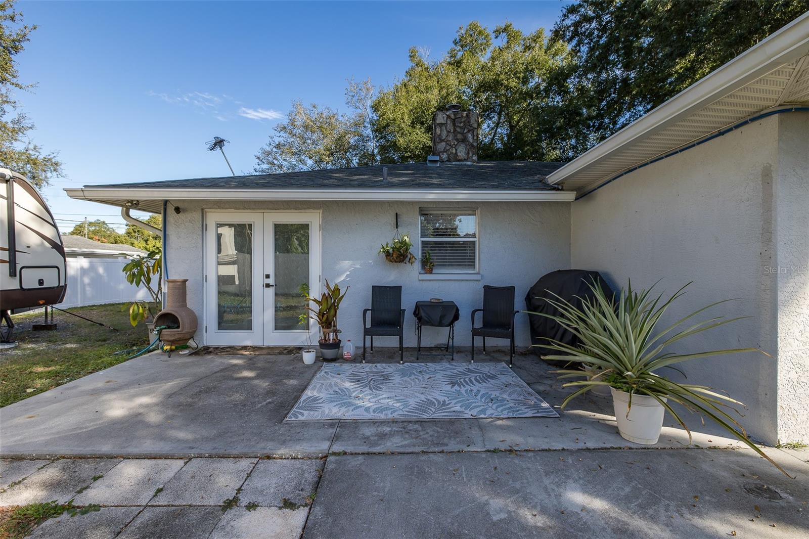 Patio in backyard outside of kitchen