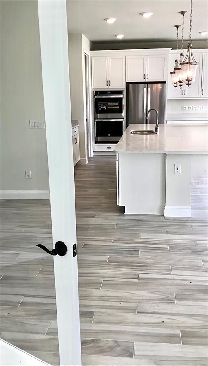 Den on 1st Floor view leading into Kitchen