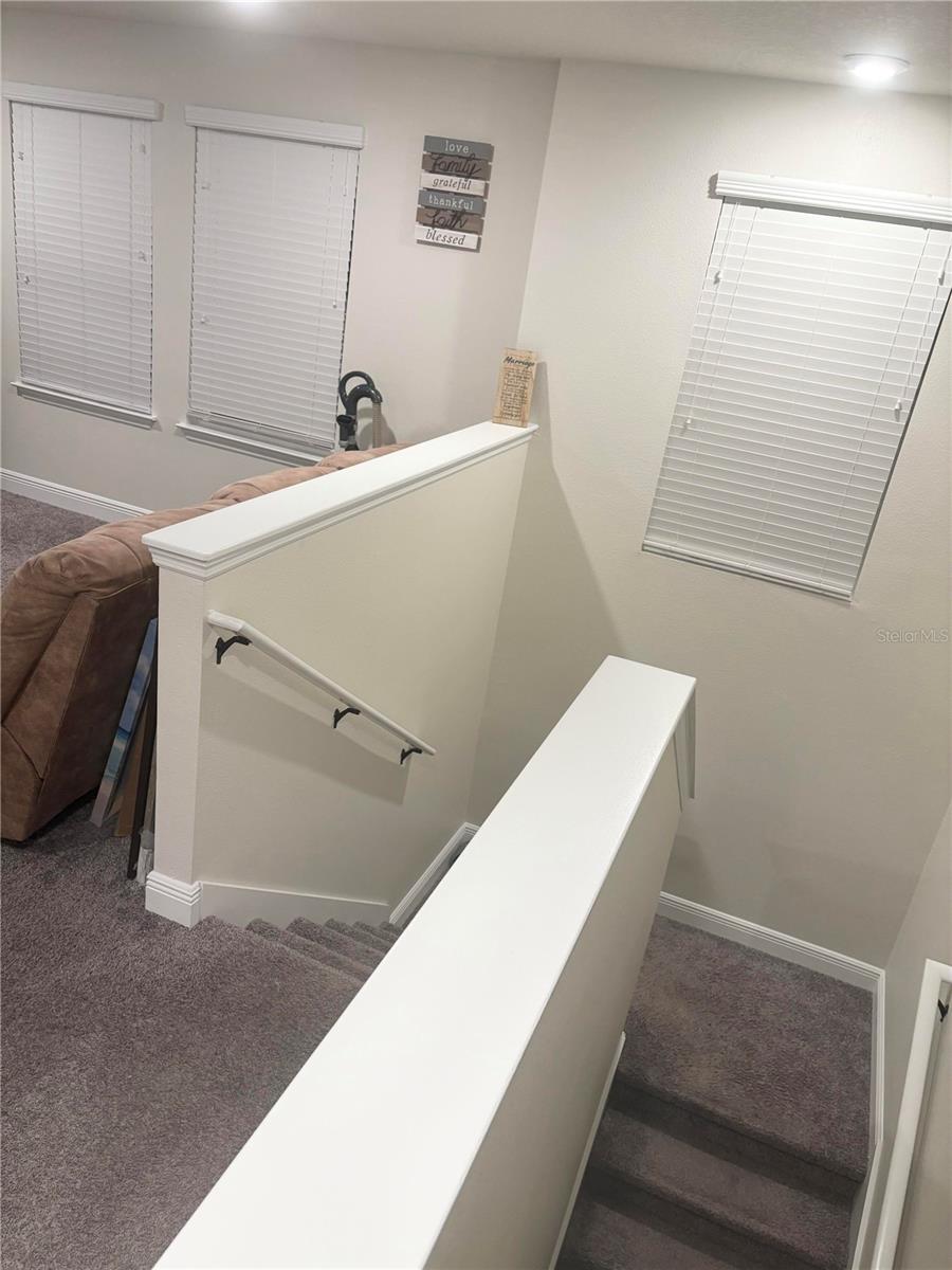 View of descending stairs from 2nd floor Loft