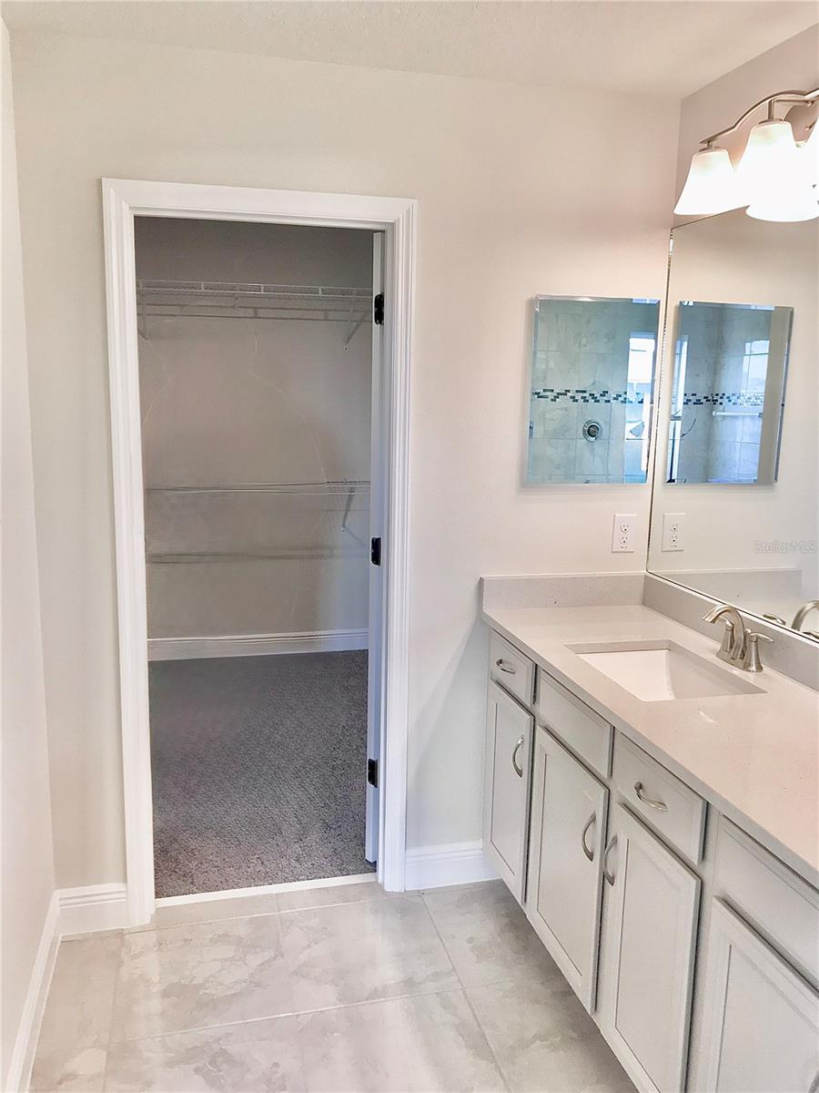 Master Bathroom leading into Master Bedroom Closet
