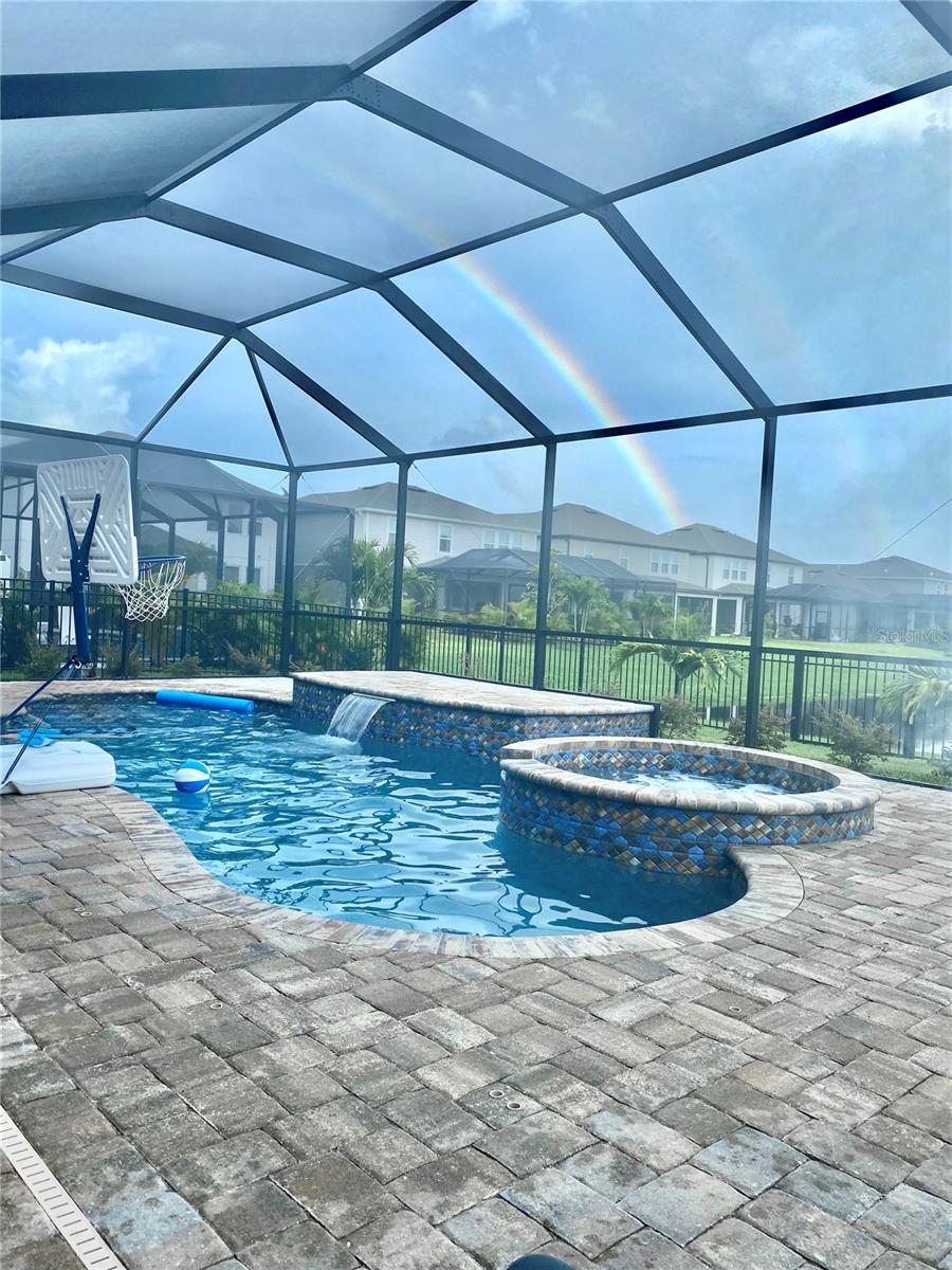 Saltwater pool with waterfall and sauna / Hot tub
