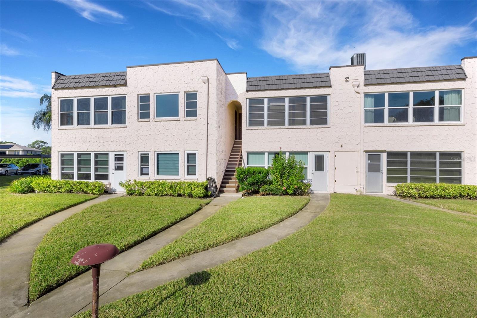 Rear of Unit with Walkway to Pool and Clubhouse