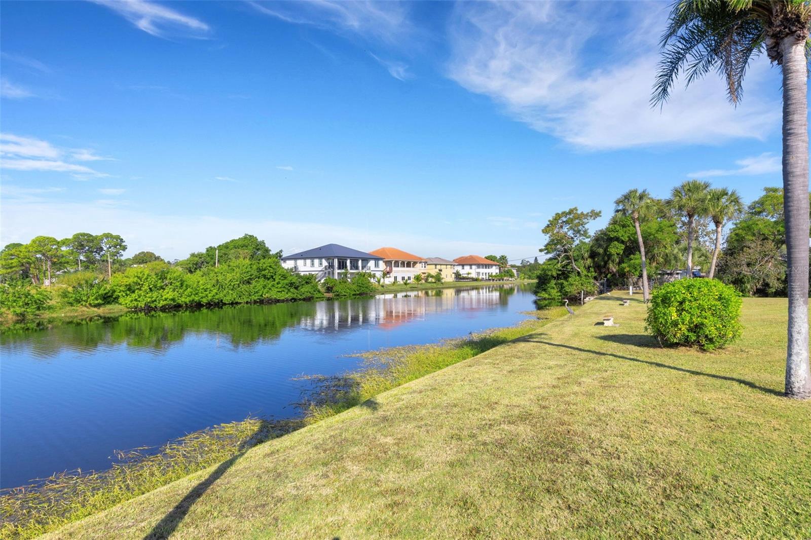Canal Adjacent to your 2 Covered Parking Spaces