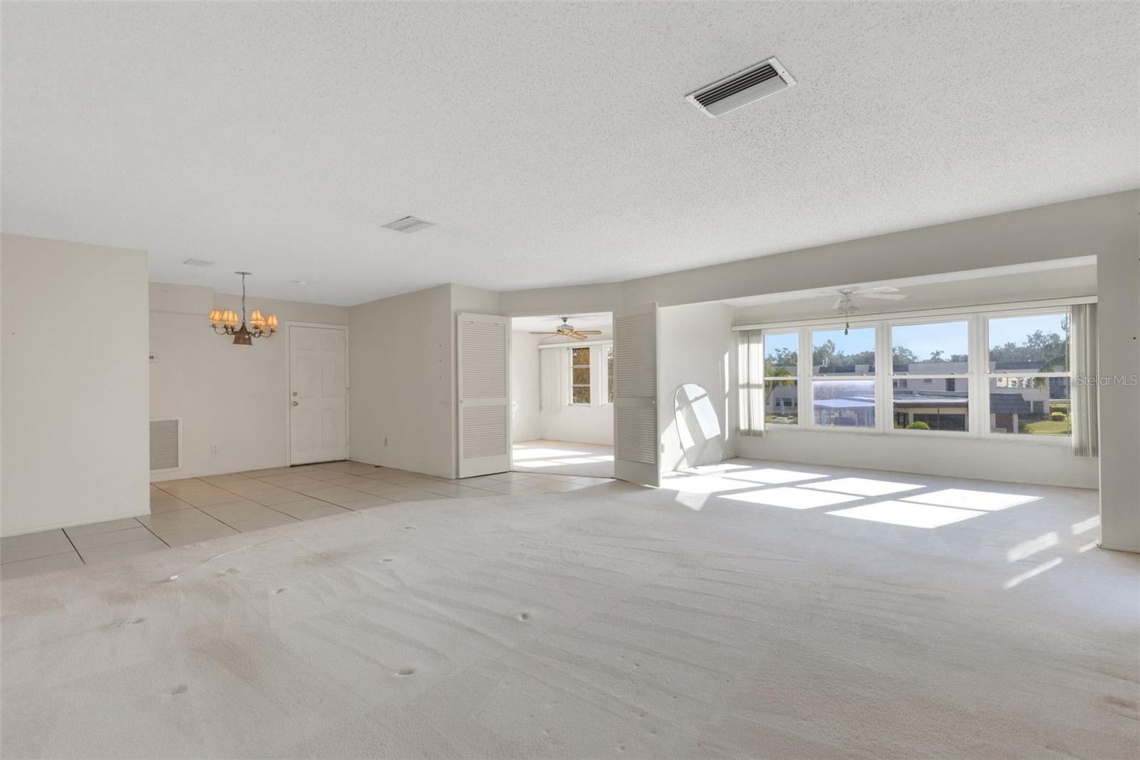 Living Room Looking to Florida Room,3rd Bedroom/Home Office and Dining Area