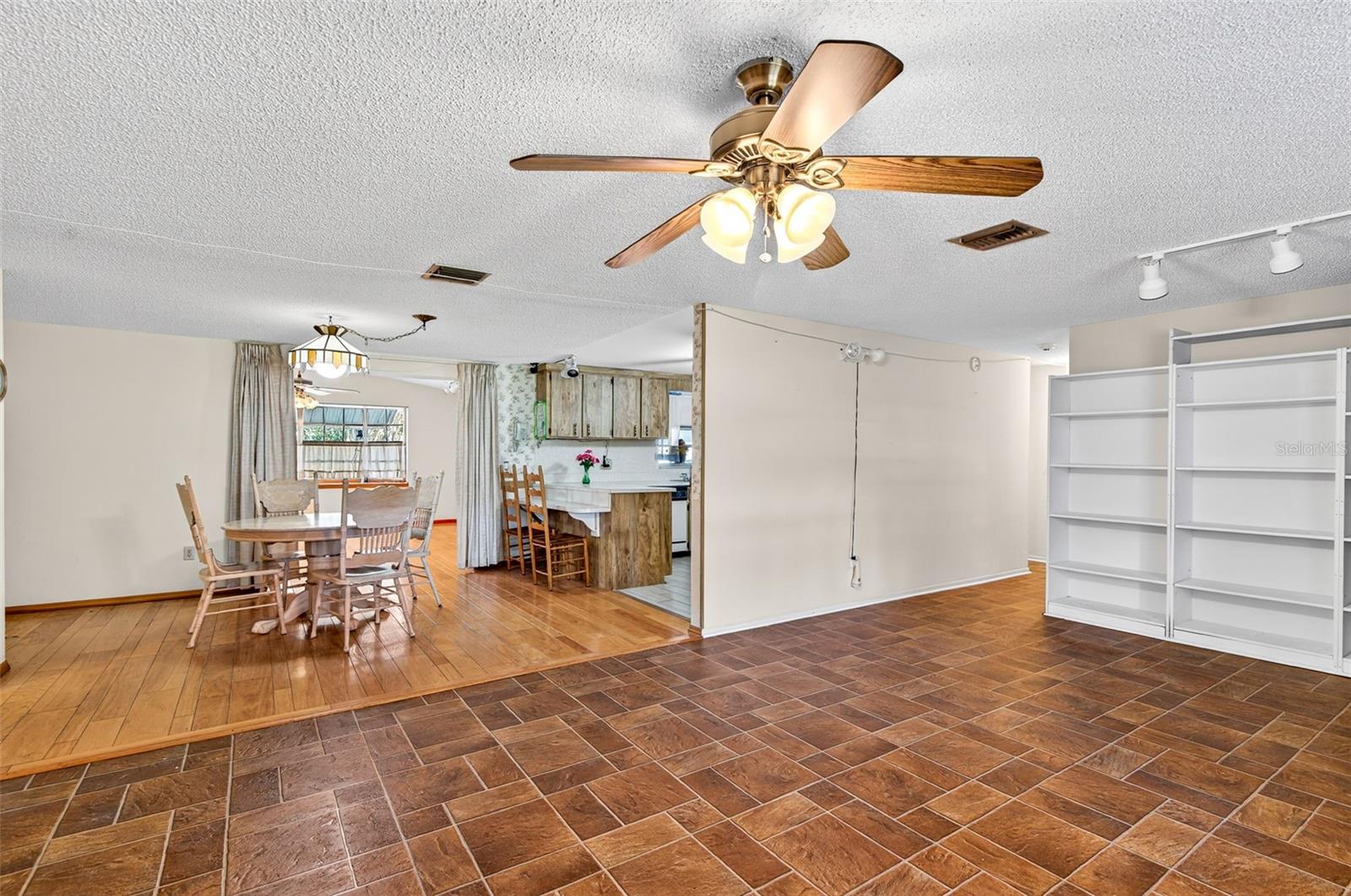 Living Room opens to Dining Room & Kitchen