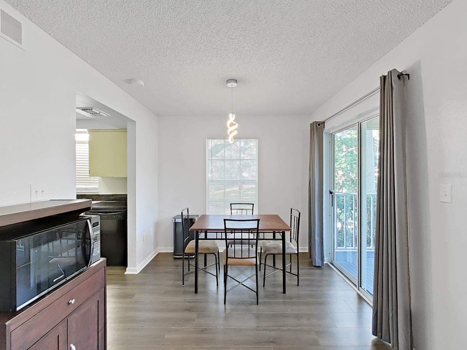 Your dining area with your Lanai to the right and Kitchen to the left!
