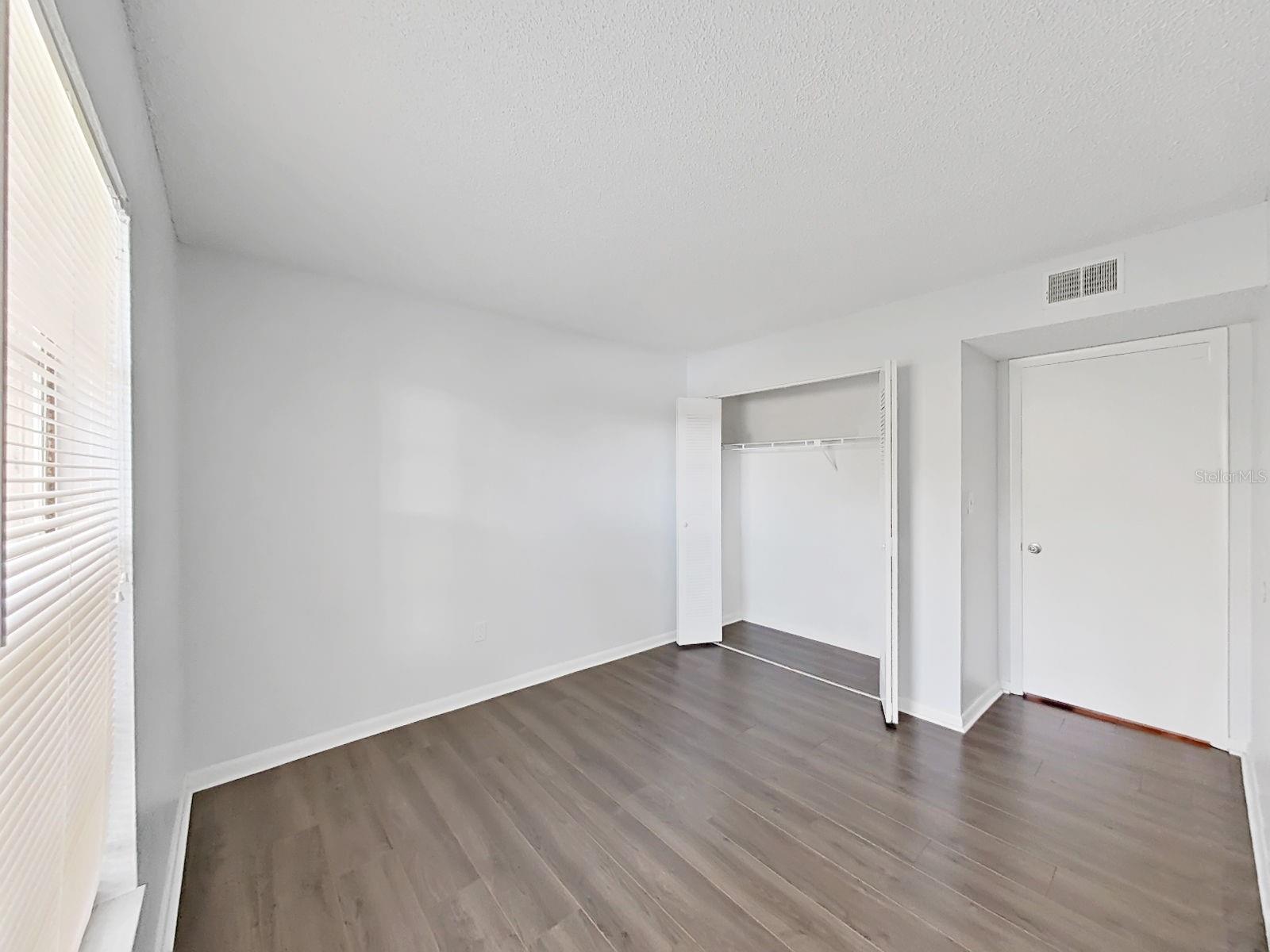Bedroom 2 with a reach-in, standard closet!