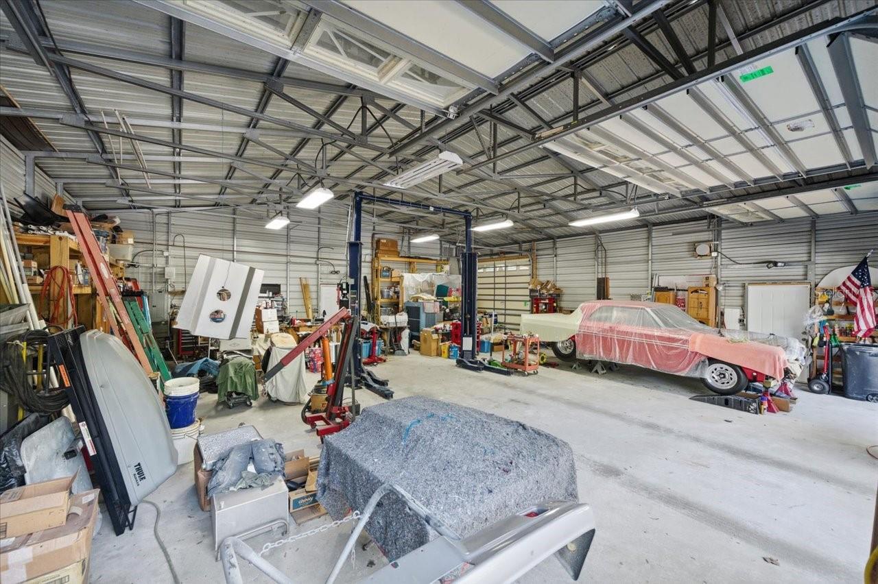 Inside the Shop with a 2 post lift that stays