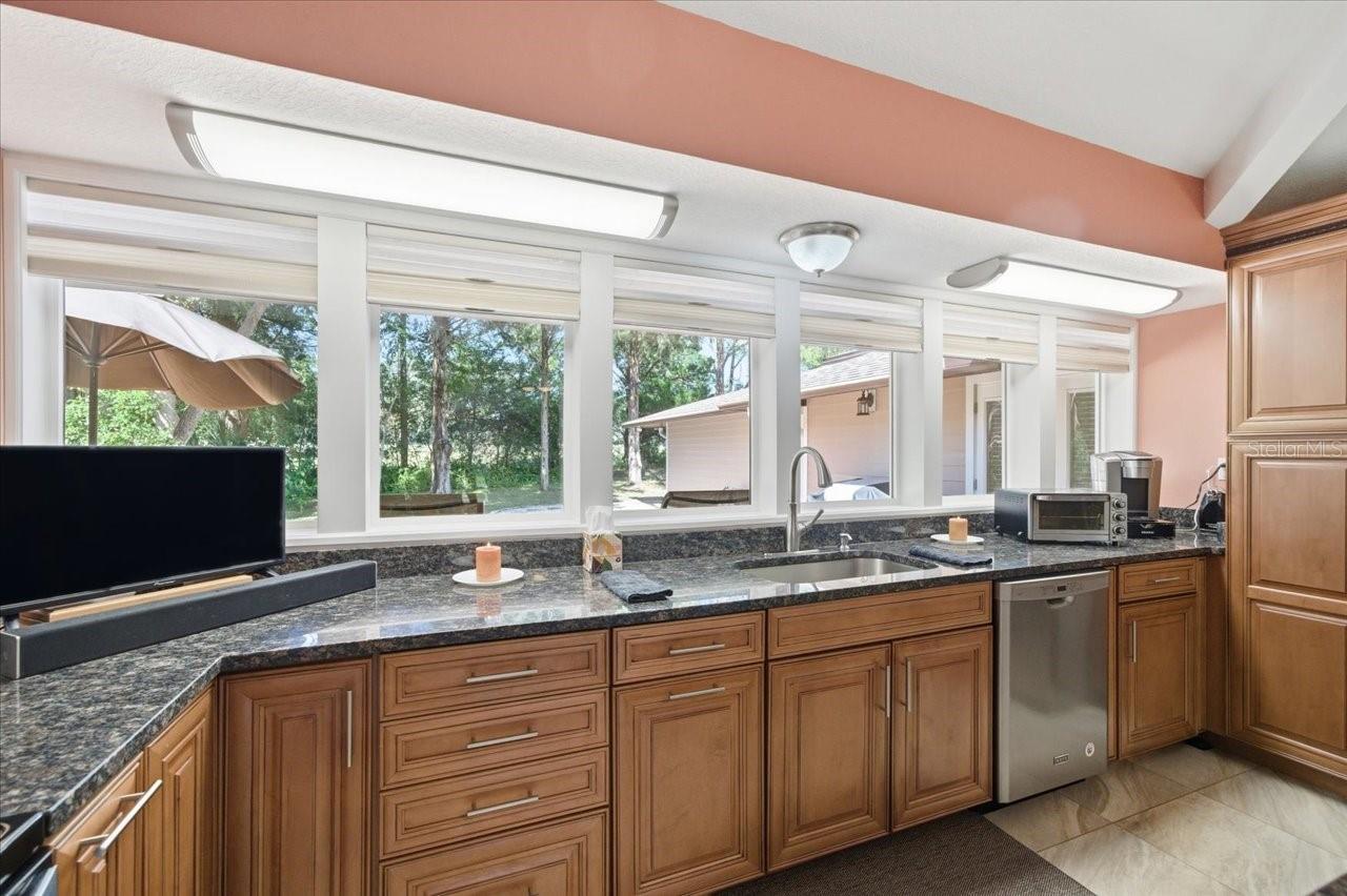 Windows over the sink looking out to the back deck.