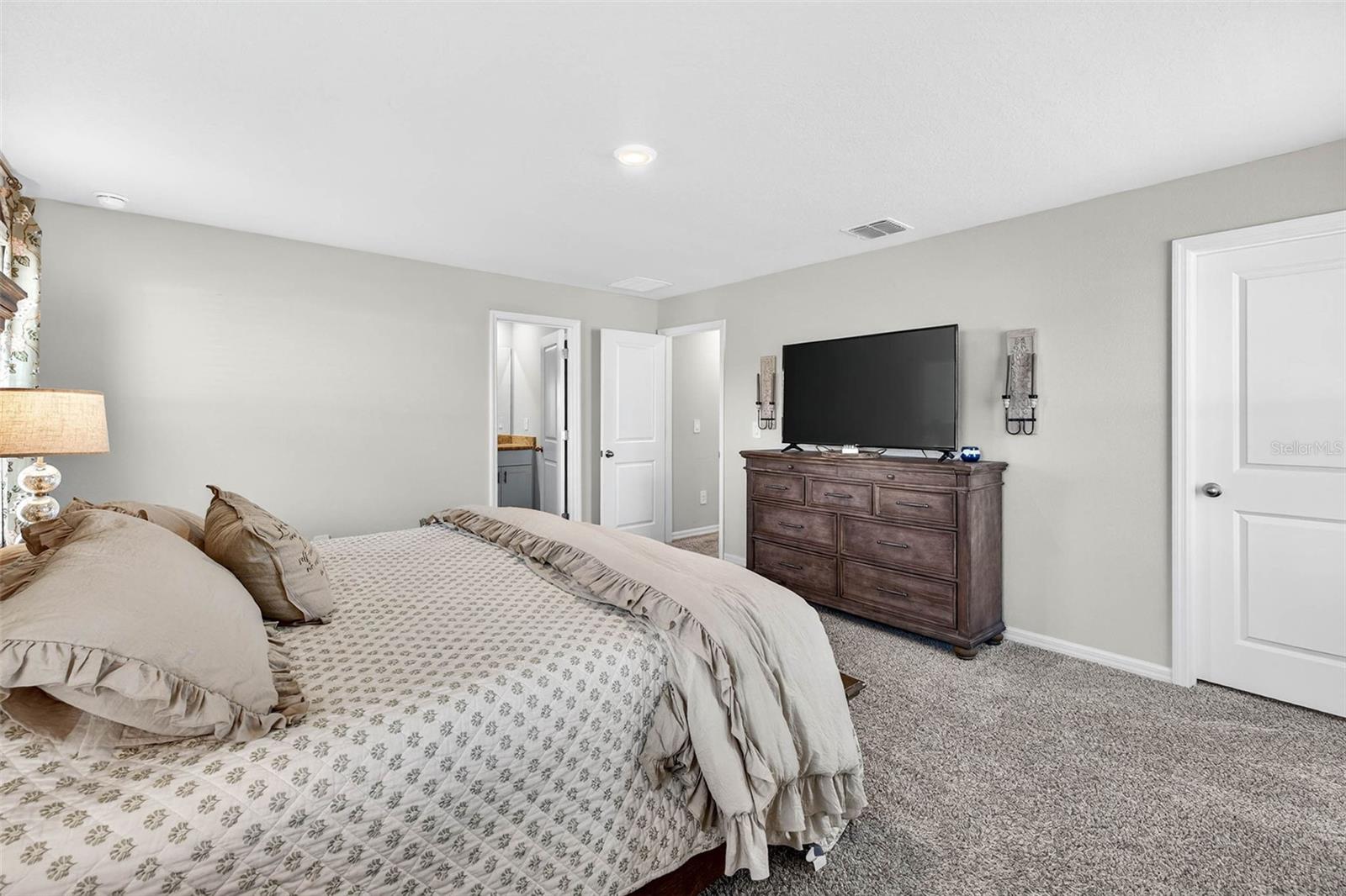 Primary suite with walk in closet.