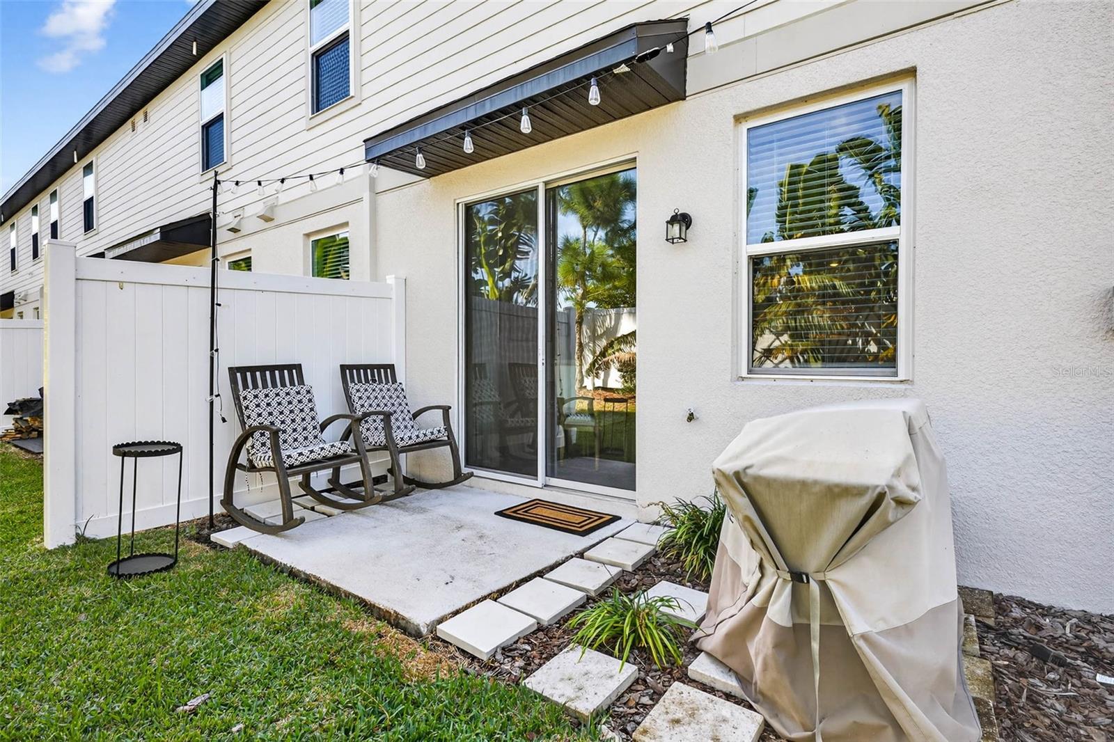 Outdoor patio with privacy divider.