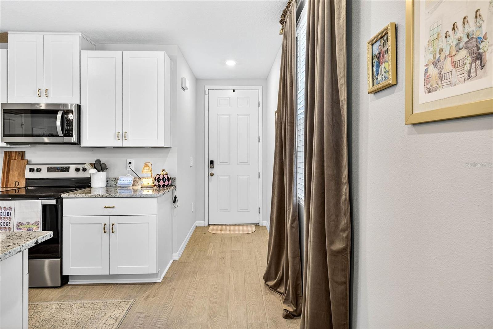 Entryway leading into the kitchen and great room.