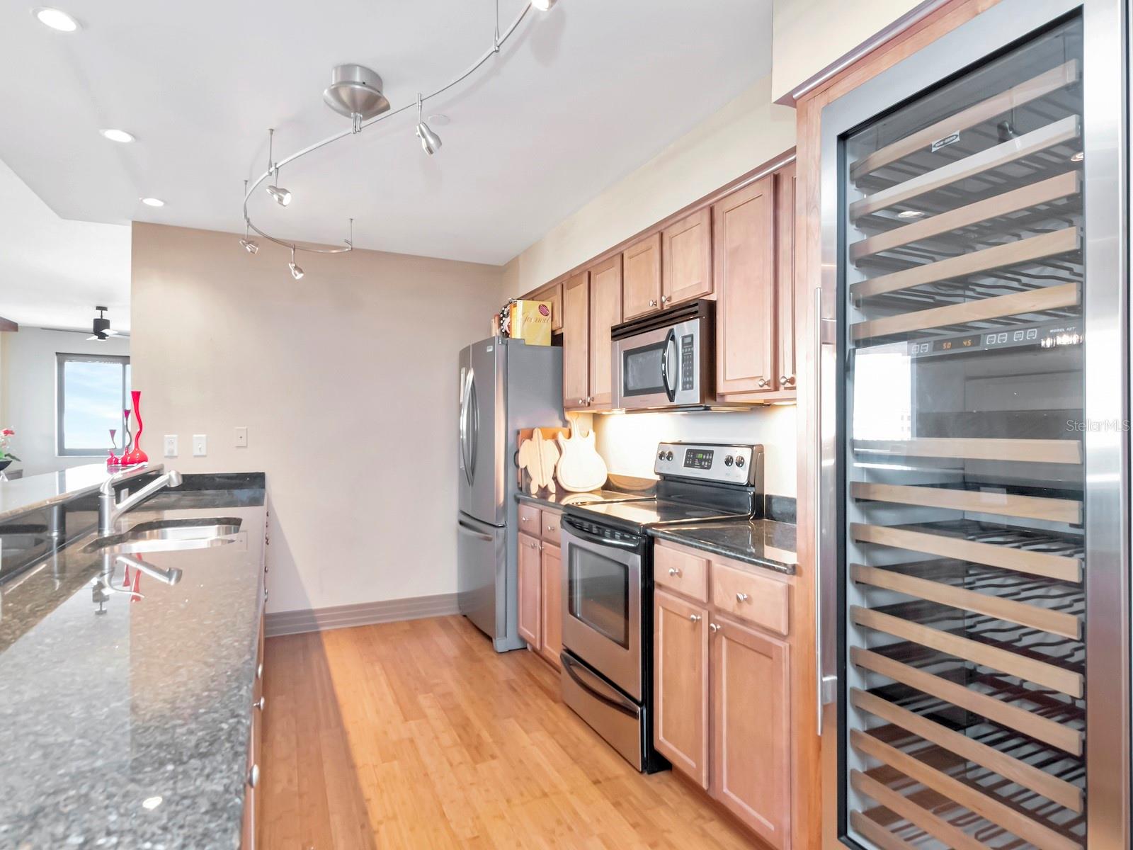 Kitchen features 78-bottle SubZero wine fridge