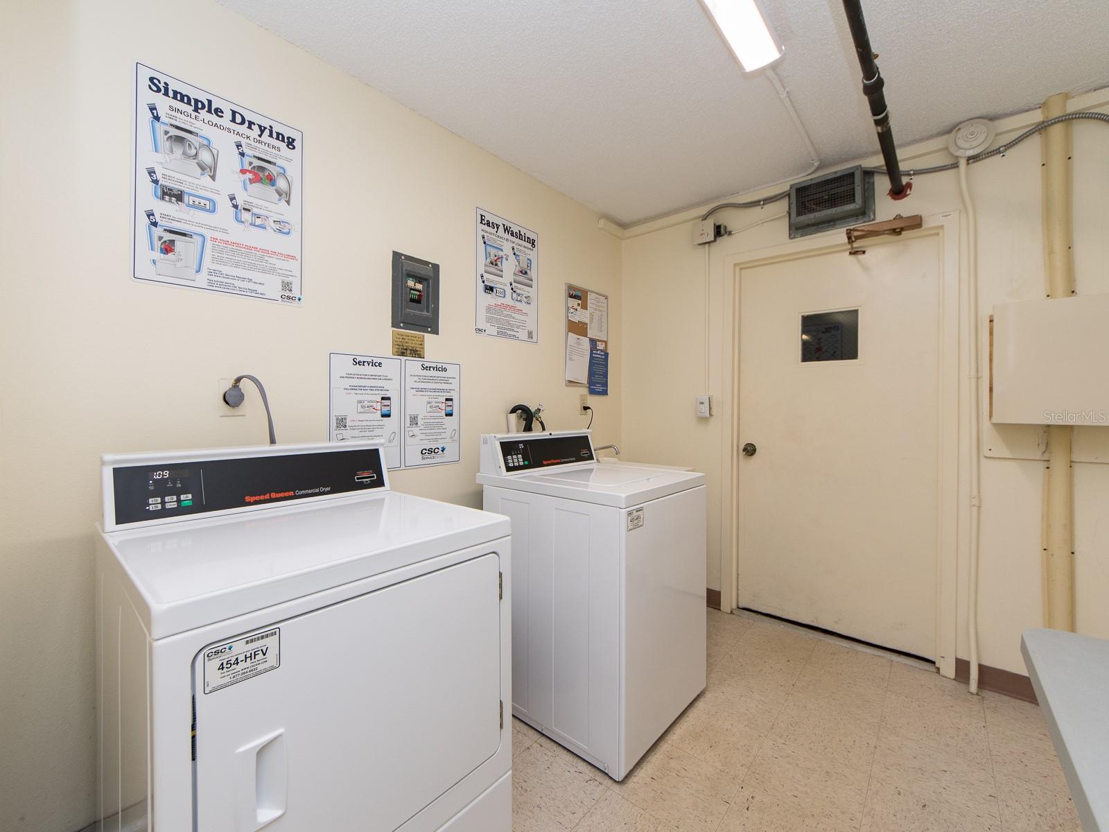 Laundry room next door  to the condo