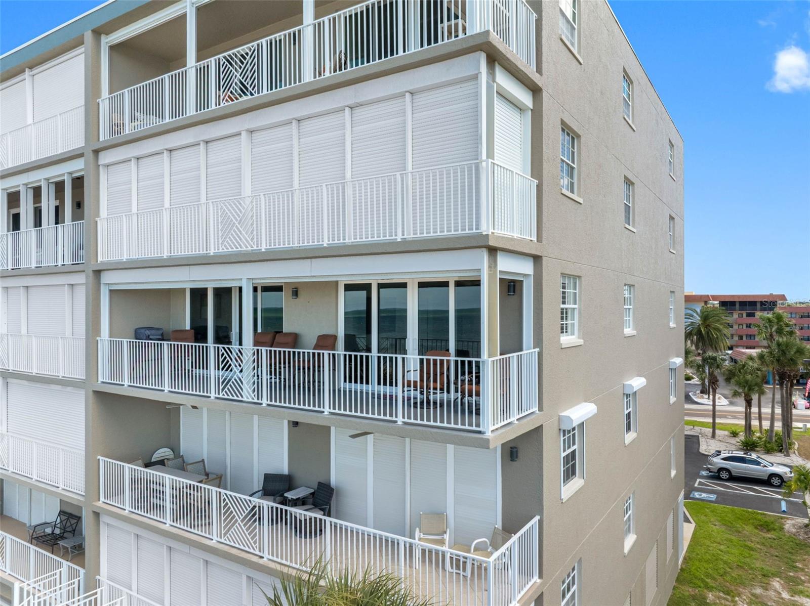 .. Residence # 301 - Strom Shutters Open - Brown Chairs on 33 Foot Balcony. Complex Has New Roof - New Ext Paint - Refurbished Pool Area & Street Parking Lot. All Work Completed and Paid For. Complex Financials in Good Shape.