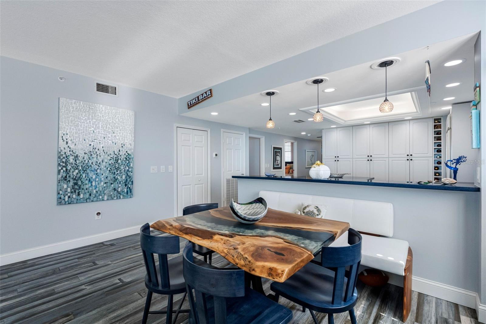 ..Designer 8'7" Ceiling Heights In Dining Area. Once again Corner unit providing extra natural light.. Laundry room iAccess - left of Kitchen Thru Open Door Next To Six Panel White Door.