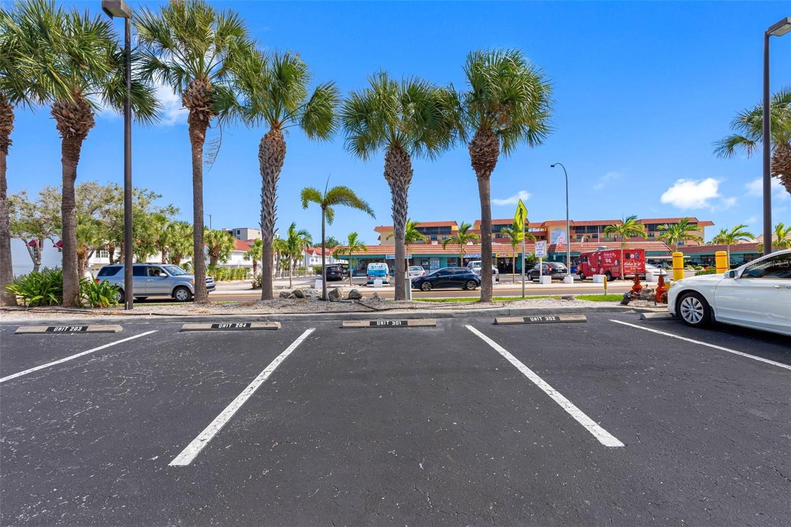 .. Corner Residence # 301 Conveys With Two Spots - One Outside Marked #301 and Another Spot in The Secured Gated Garage.