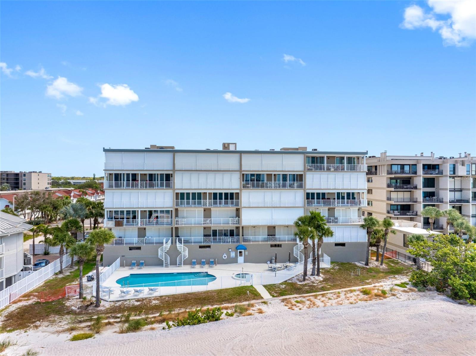 .. All Vegetation & Palm Trees New 2025.. Residence # 301 Third Floor SW Corner or Right Side of Complex - Storm Shutters Open. Complex Has 20 Units - 4 Per Floor - Shared Storage on Every Floor - Plus Private Storage for Each Unit in Garage By Parking Spot.